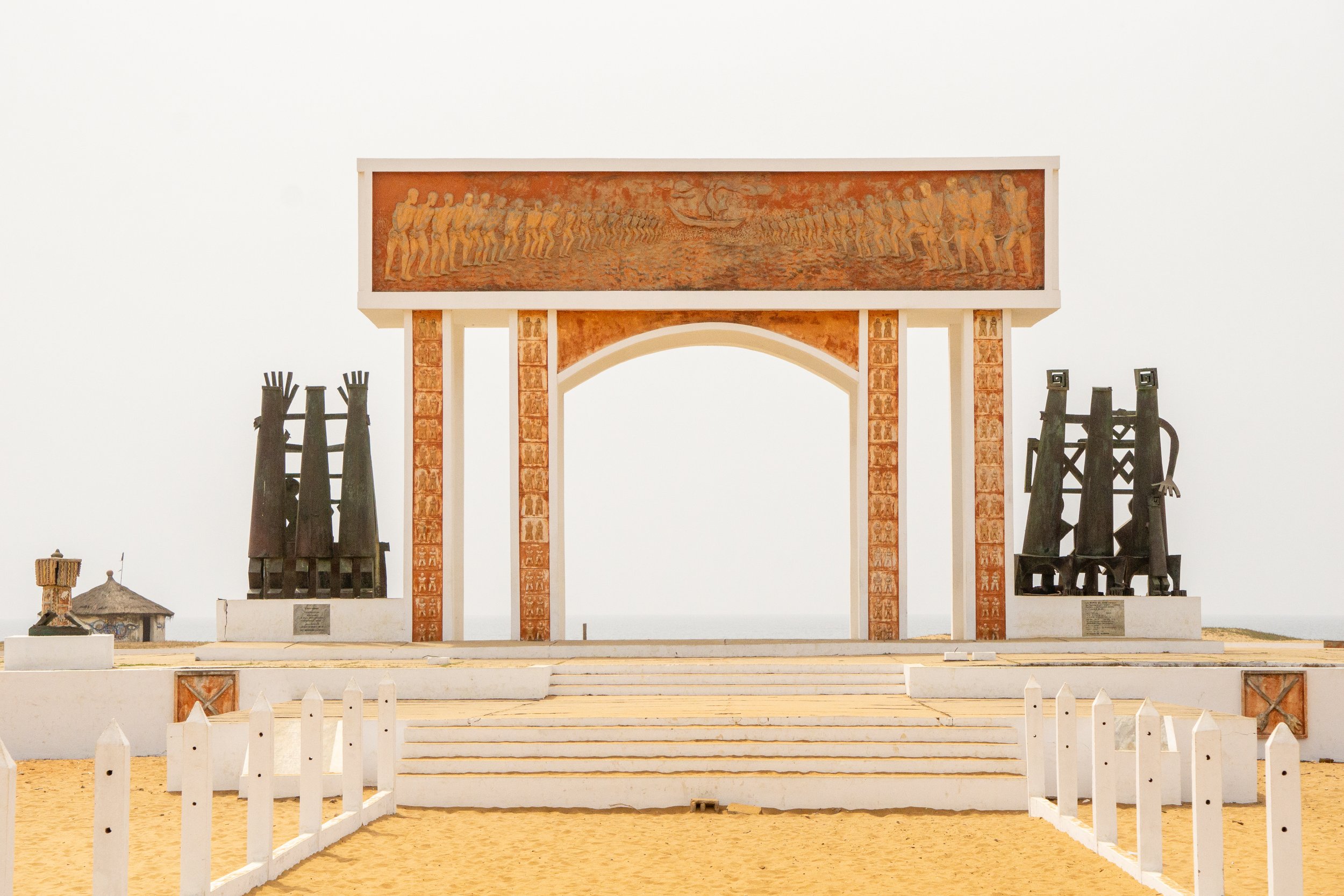 The Door of No Return stands on the beach in Ouidah, Benin, West Africa and is a bronze and concrete memorial arch memorializing more than one million Africans enslaved and taken to the America (Copy)