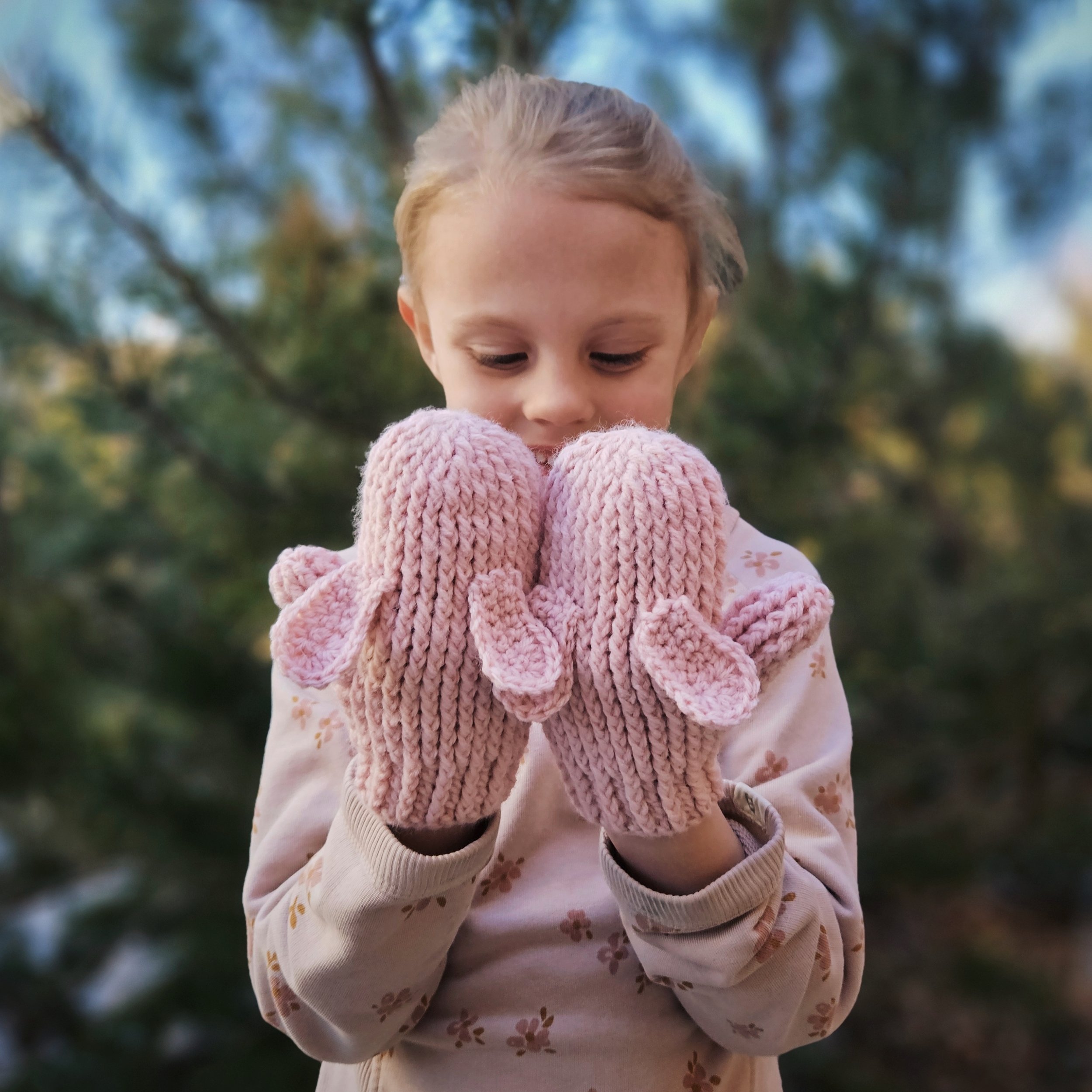 Cozy crochet mittens with optional bunny ears, showcased on hands in a winter setting.