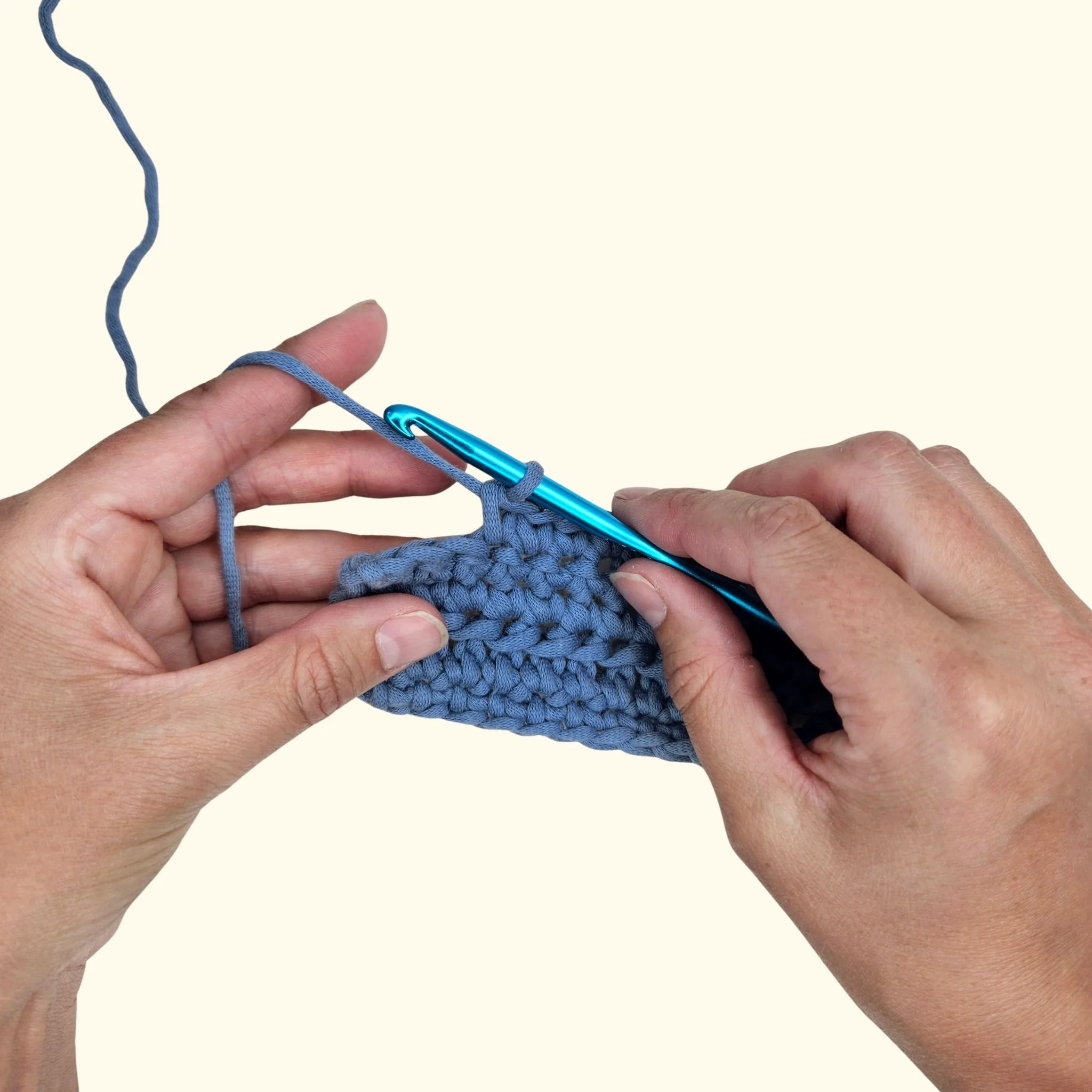 How to Hold Yarn and a Crochet Hook (Beginner's Guide)