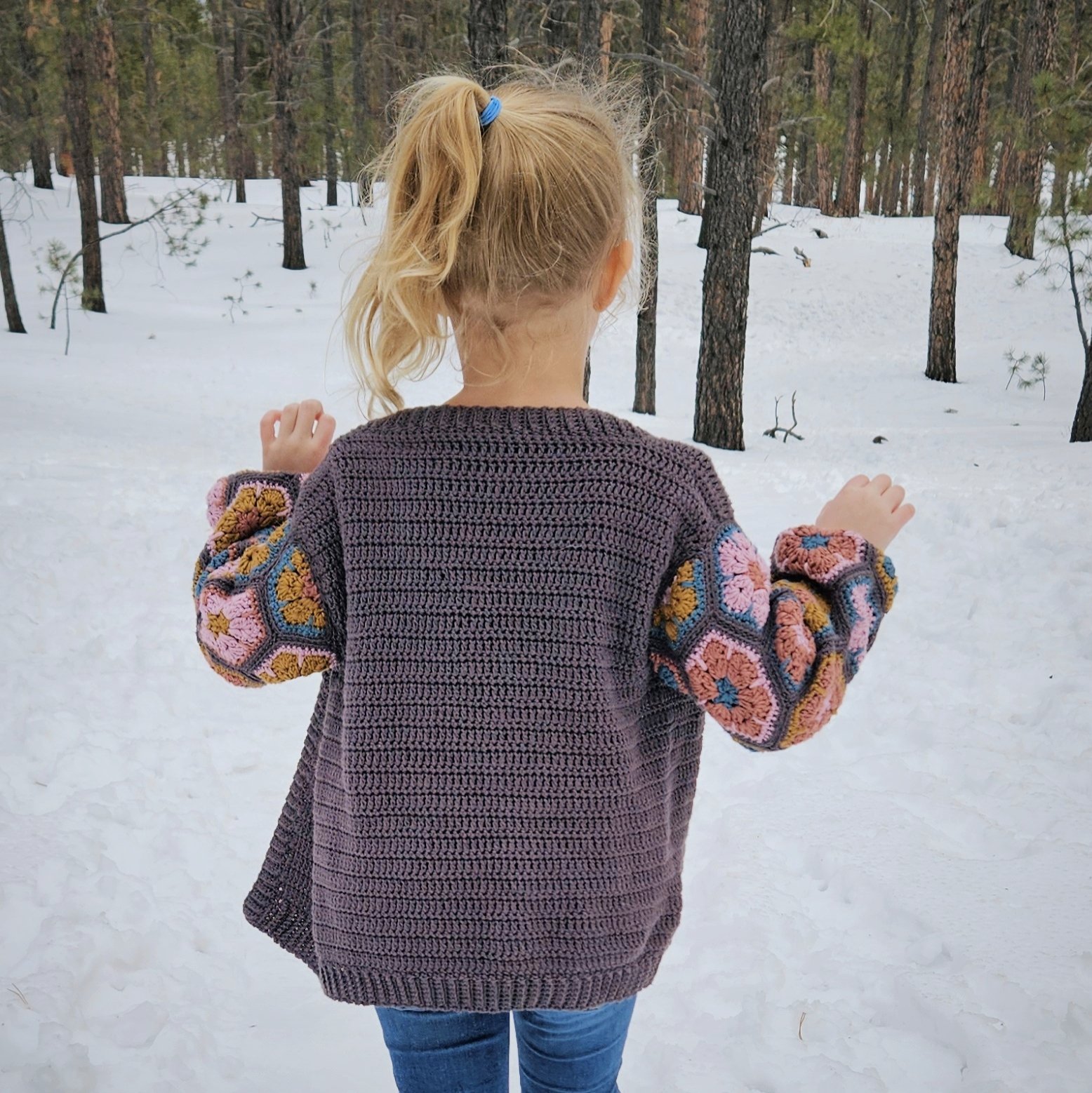 Handmade crochet cardigan with colorful hexagon granny square sleeves