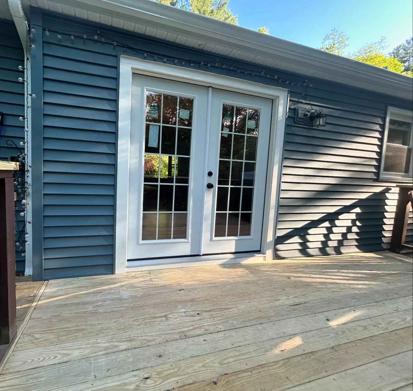 New decking installed ✅ old slider replaced with a nice double French door ✅ and all done in time for Memorial Day weekend! 🇺🇸