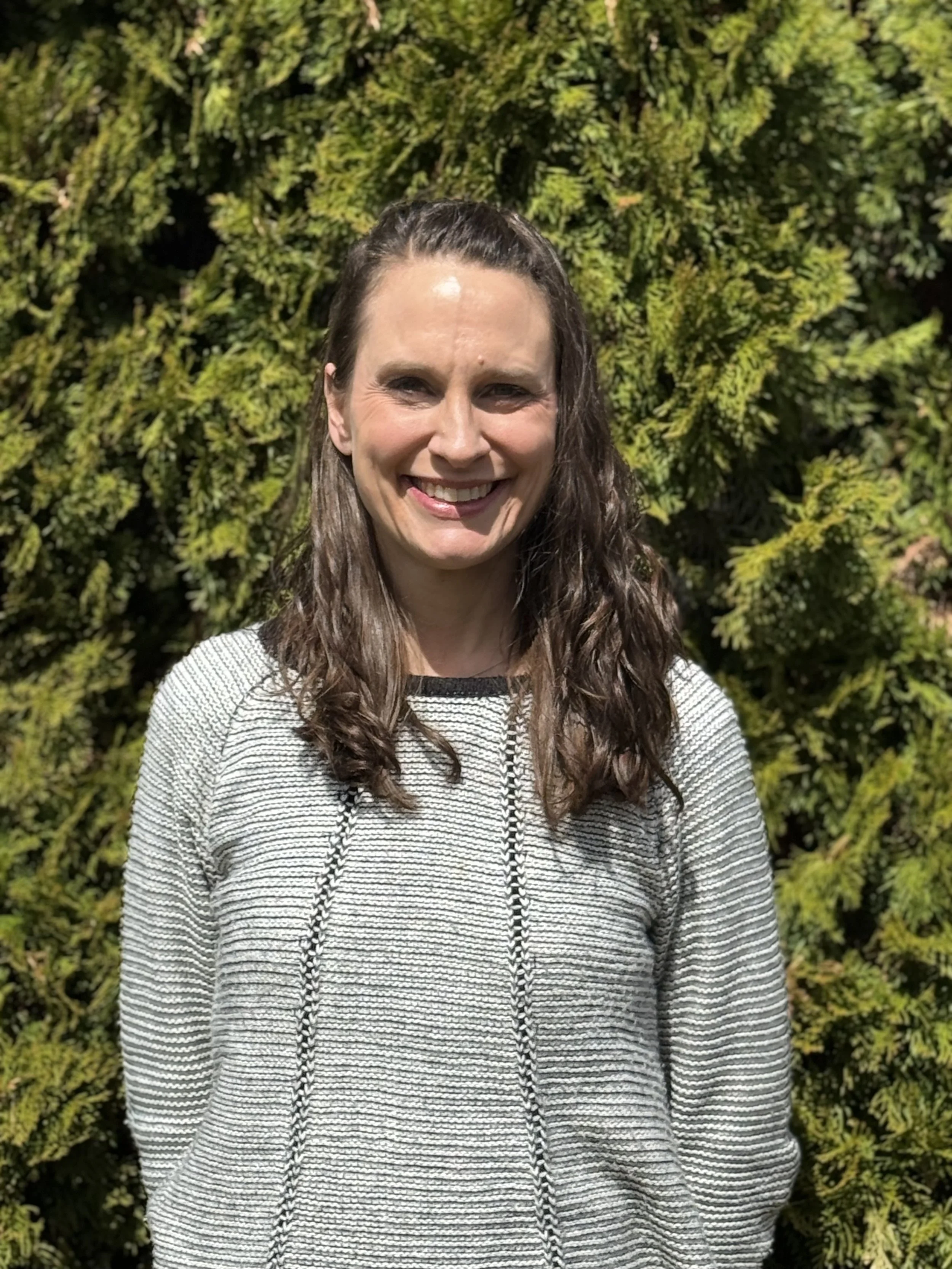 smiling NHIC Employee