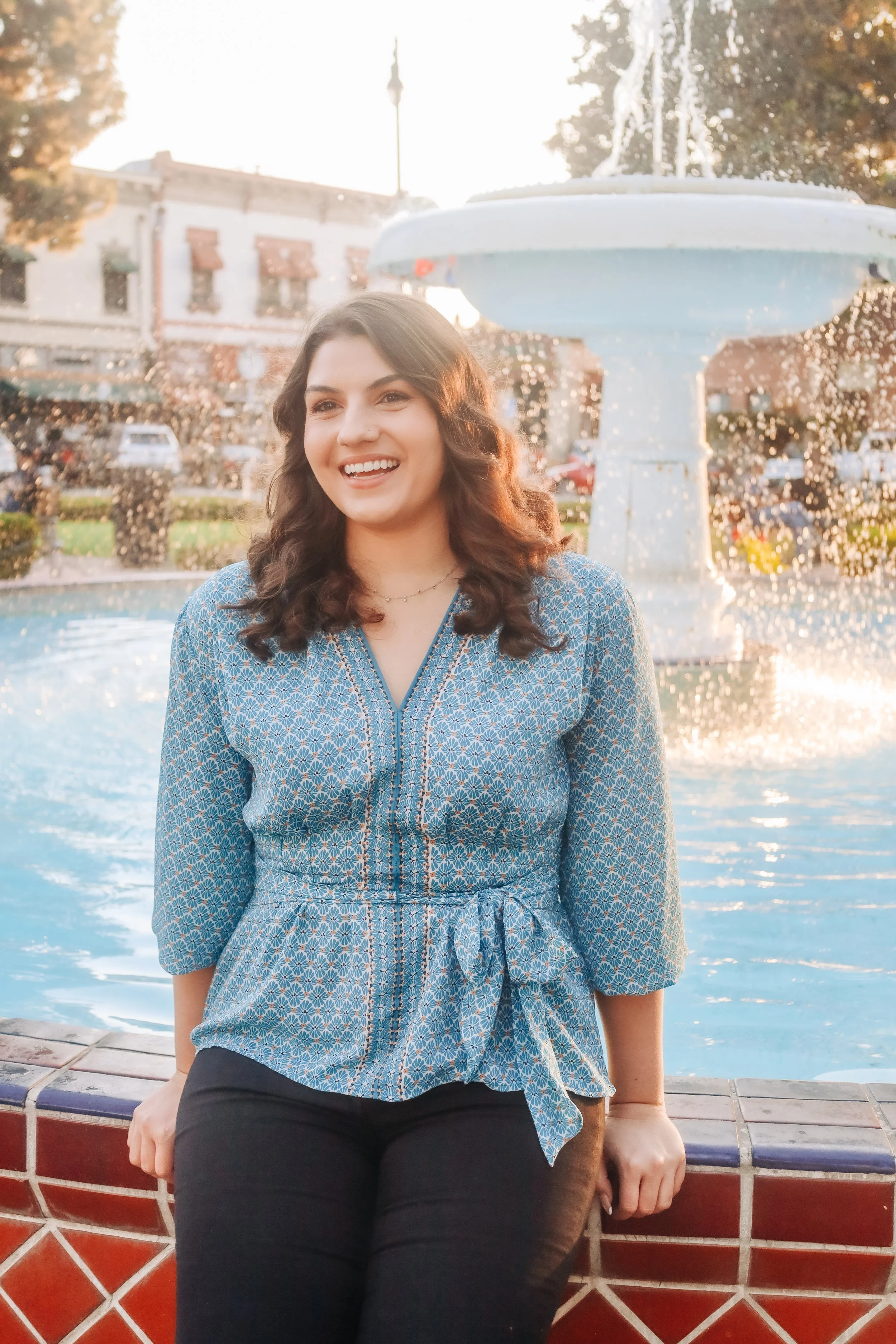 Laurie’s customers, Fernando and Kate embracing by the lake on their wedding day.
