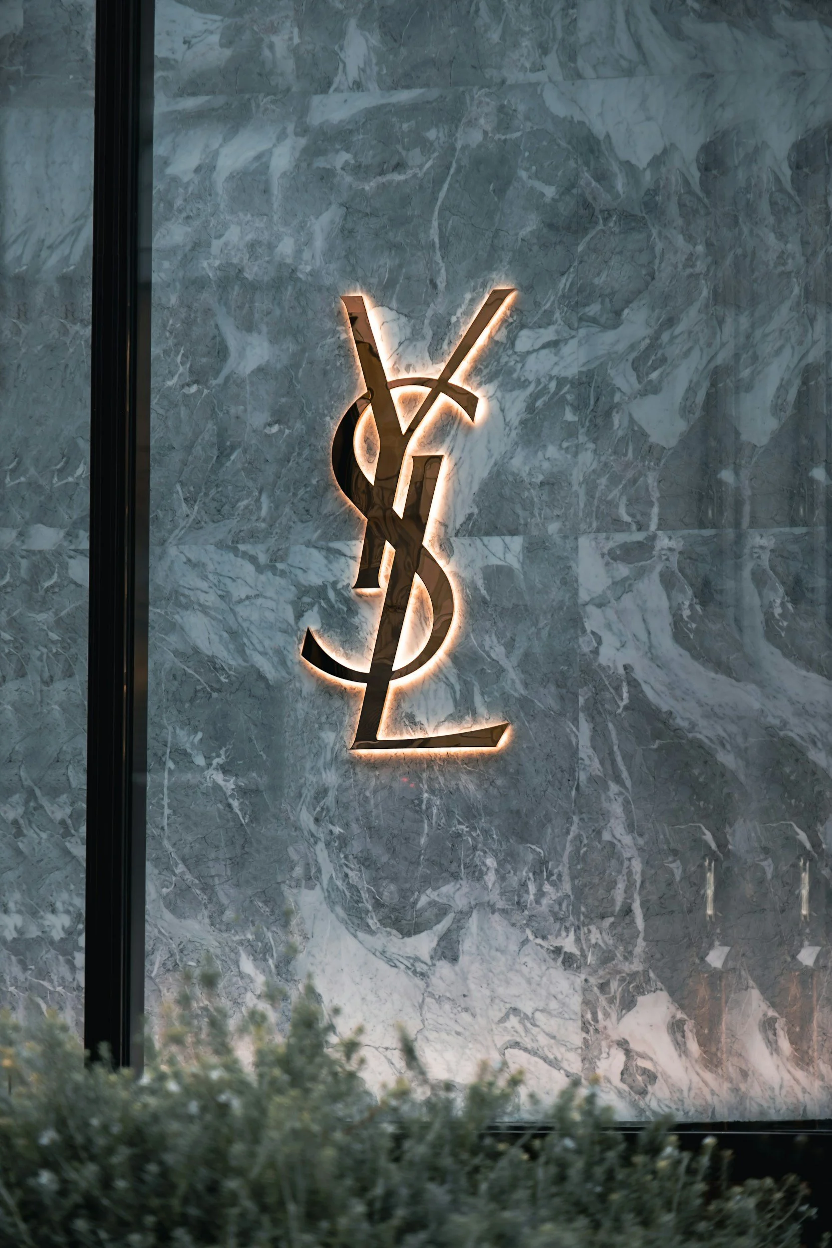 Luxury retail storefront exterior in an urban setting, representative of high-end properties that require professional valet and parking management.