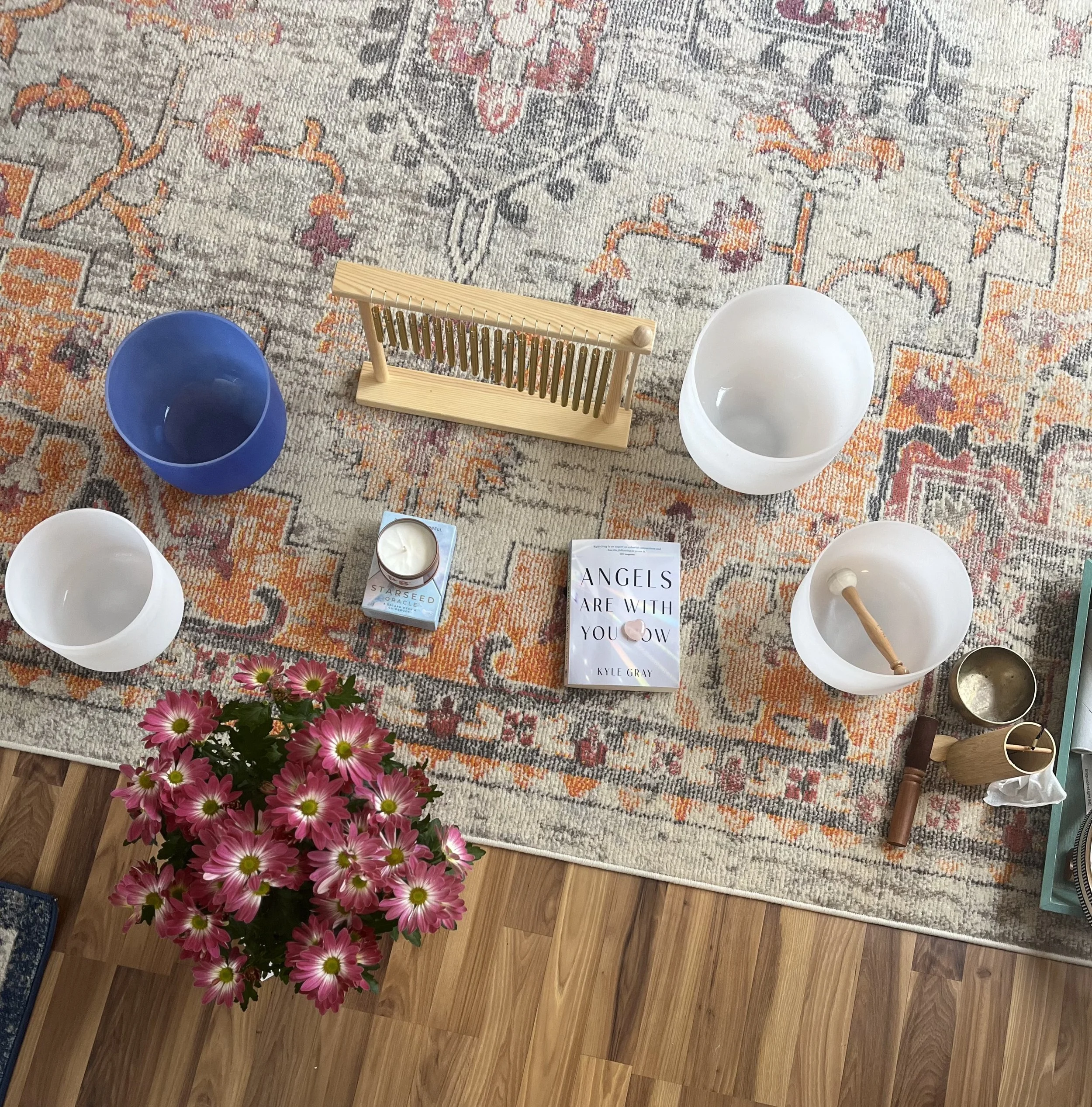 Sound bowls, chimes, and tuning forks used during sound bath healing sessions.