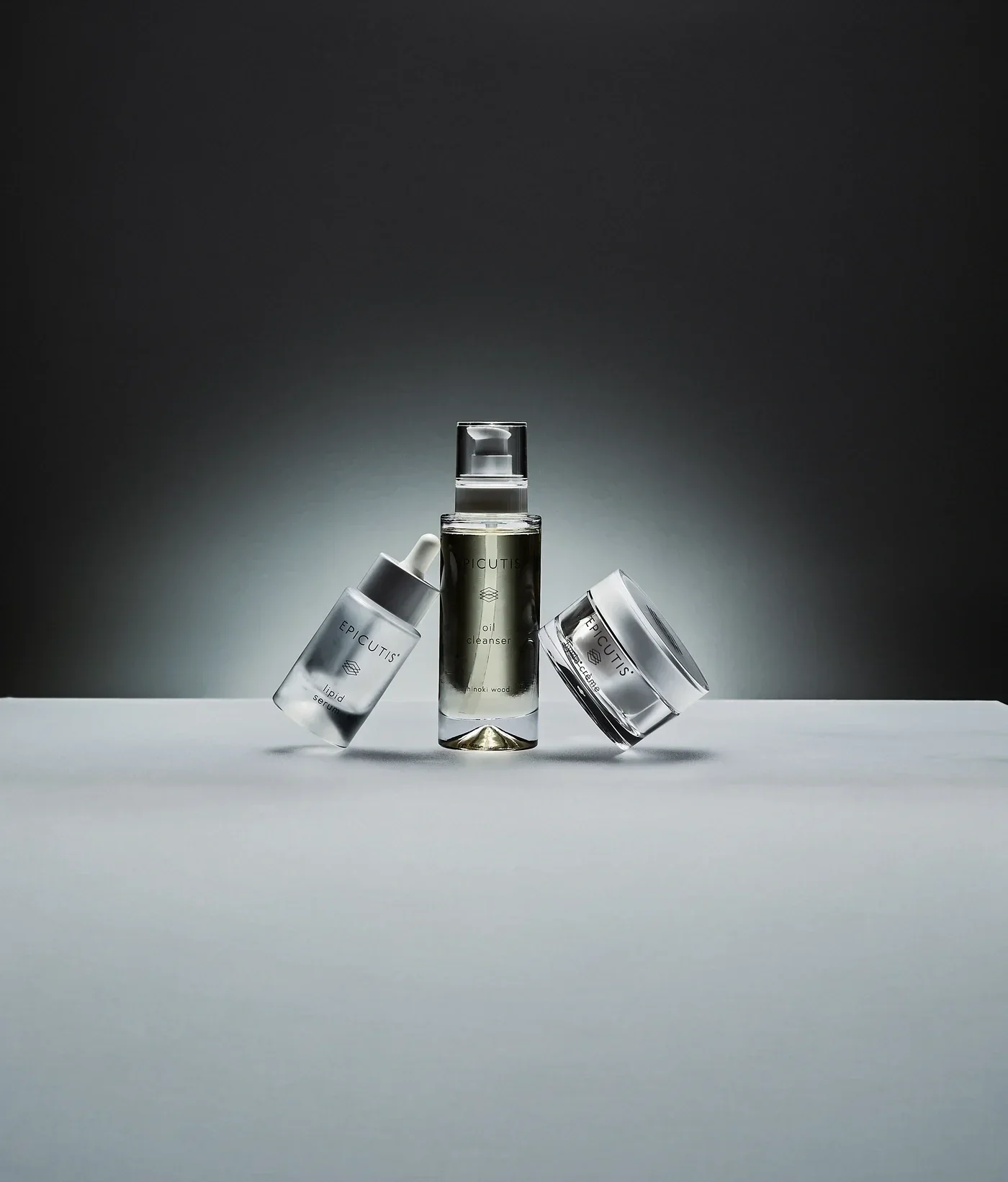 Epicutis bottles against white and dark background