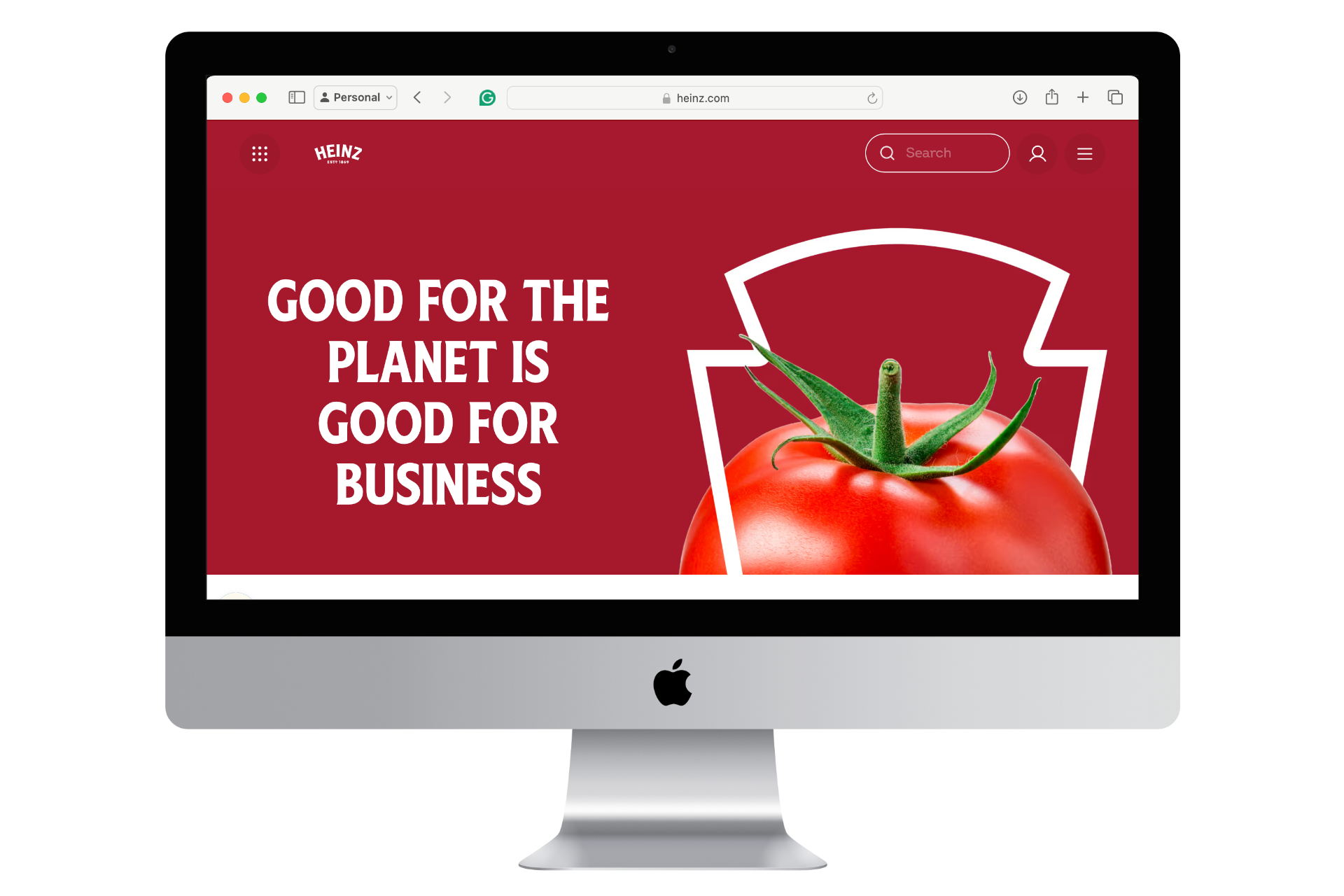 Monitor displaying Heinz website with sustainability message and tomato graphic.