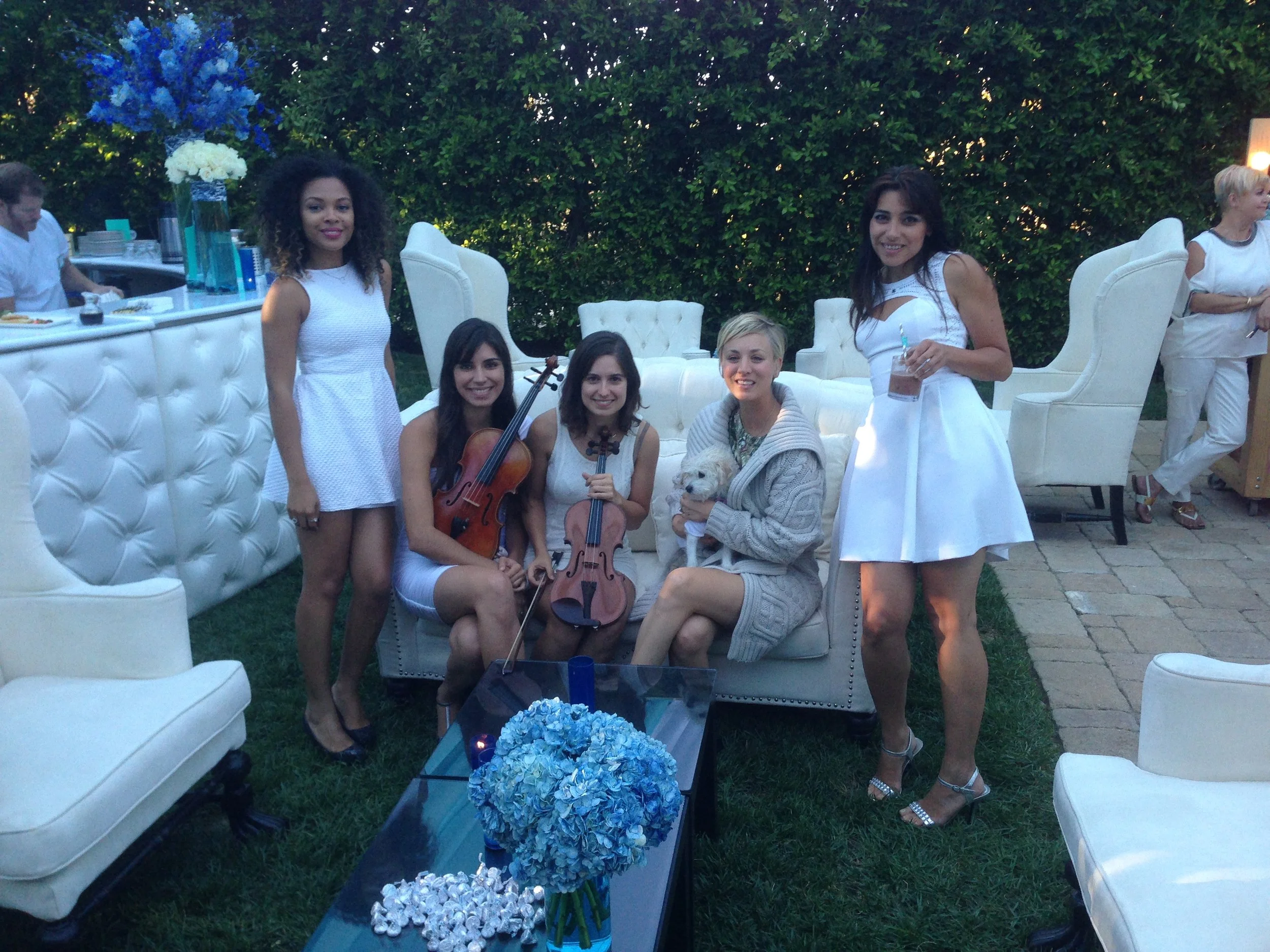 Electric string quartet performing modern songs live at a luxury event in Los Angeles