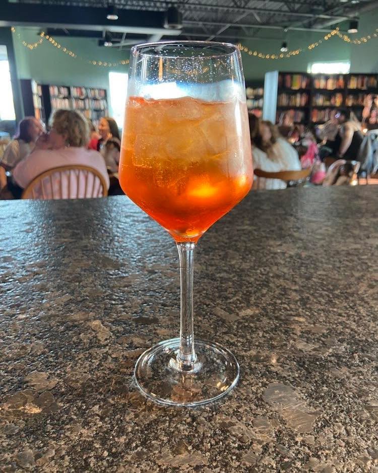 It&rsquo;s a beautiful day for a VERY SIPPABLE Aperol Spritz! Come try one of our summer specials today! ☀️😎
&bull;
&bull;
&bull;
#cafe #cocktail #mocktail #ohio #smallbusiness #coffeeshop #sanduskyohio #book #sandusky #bookstore #cheeseboard #coffe