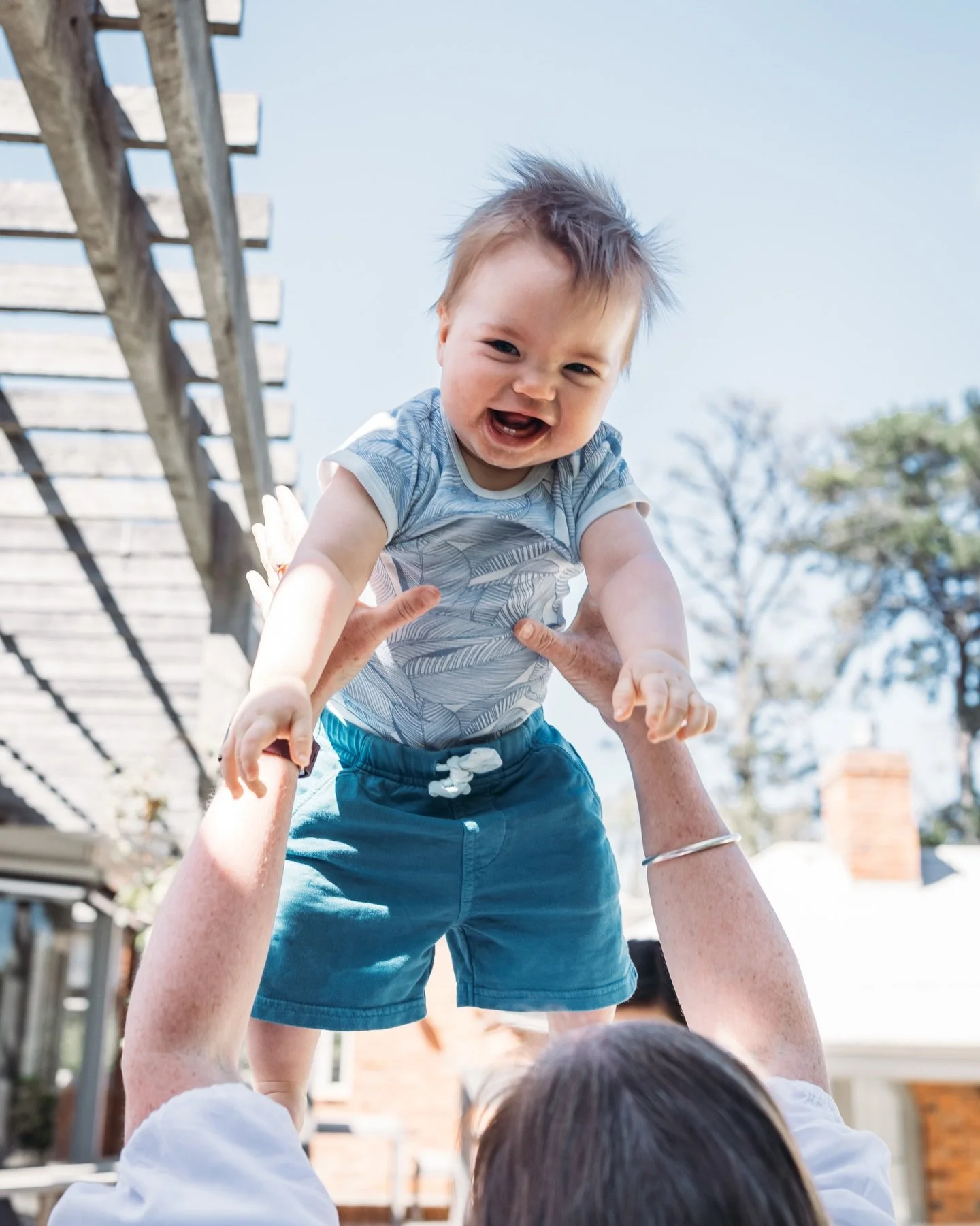 An afternoon in the backyard doing very serious family things.

Being thrown into the air 100 times.
Wrestling dad into submission.
Running through the garden with your wooden mobile phone, always ready for a phone call.
Convincing grandma and grandp