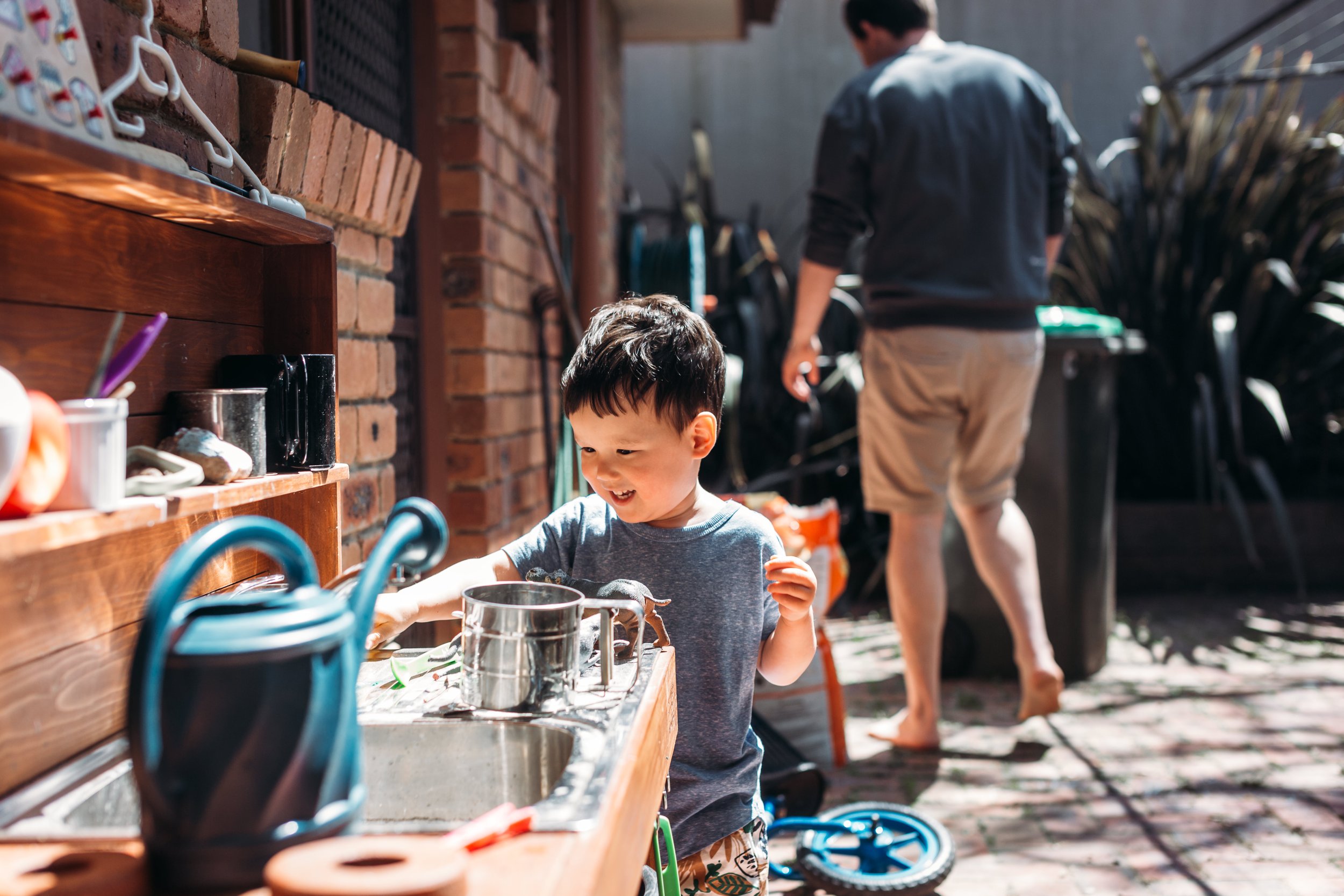 Mud kitchens and a new baby brother