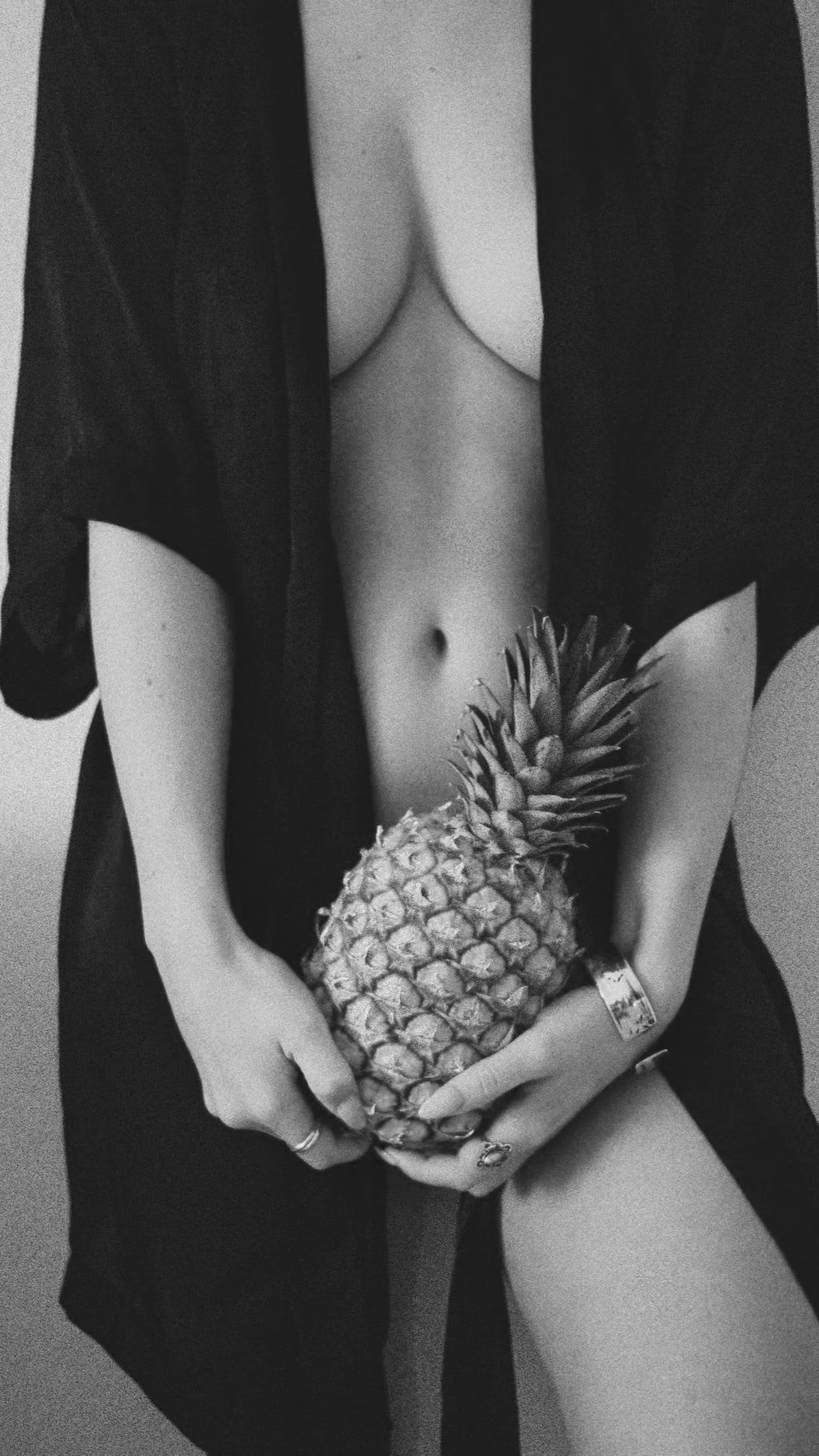 Woman showing her breast cleavage, wearing black.