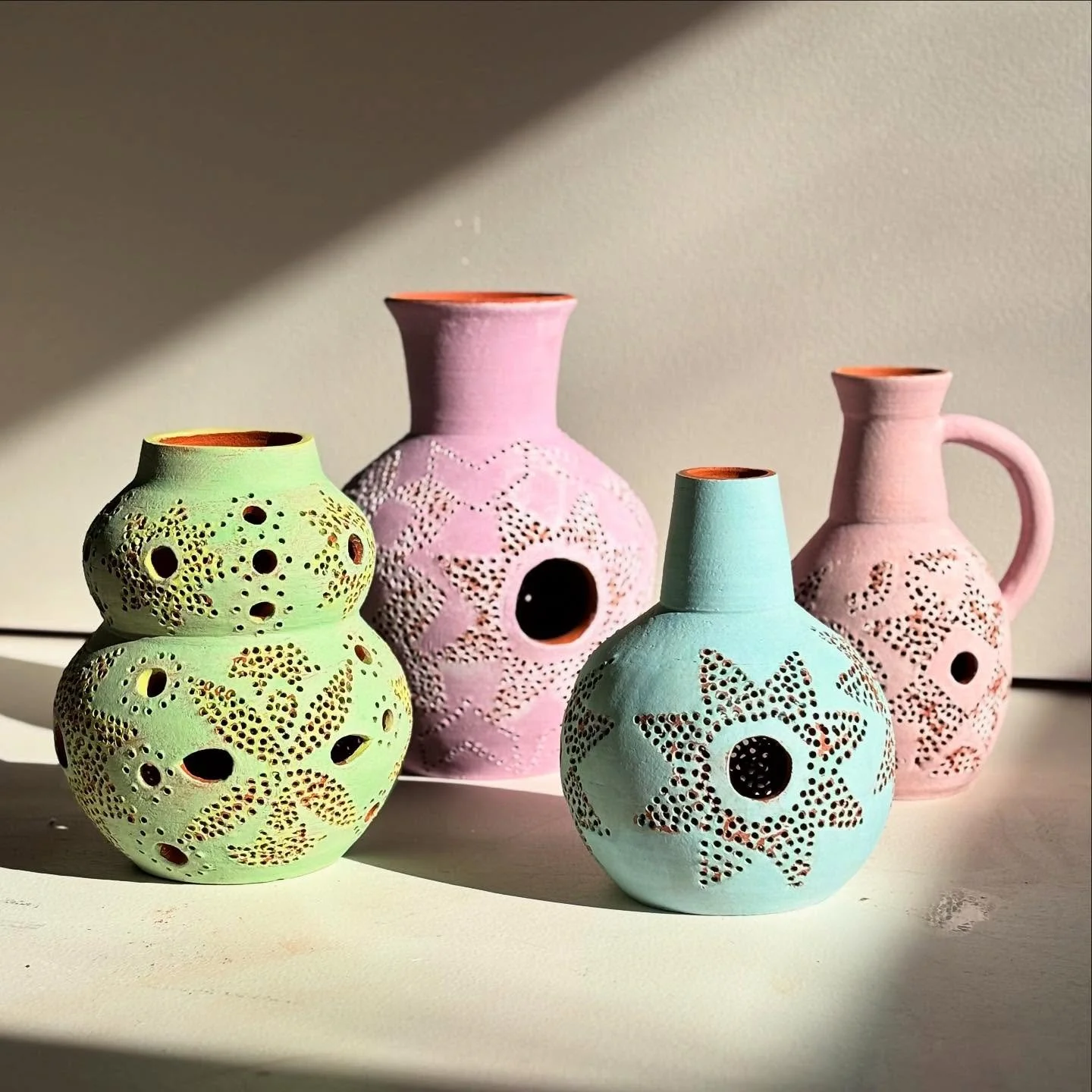 Here is a little of what I&rsquo;ve been making lately - vases with holes and no base. I&rsquo;m interested in the little glimpses of terracotta and light that shine through and the pattern the holes make. But they can be used to hold flowers as each