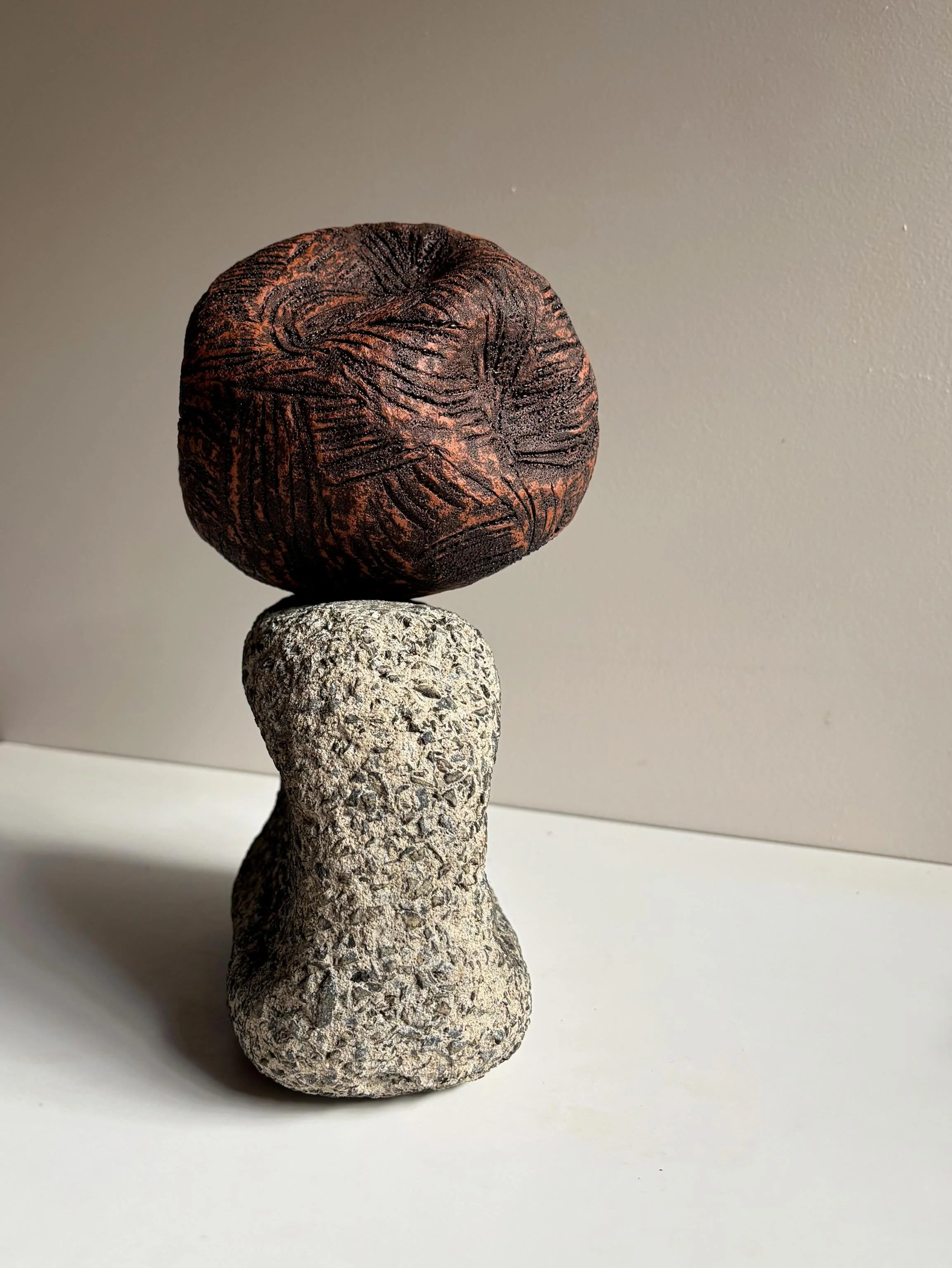 Surge Sentinel traces the journey of this piece of concrete: the sand it was formed from, to the structure it once belonged to, and finally into the grasp of the sea. Over time, the currents wore away its sharp edges, discarding it on the shore for m