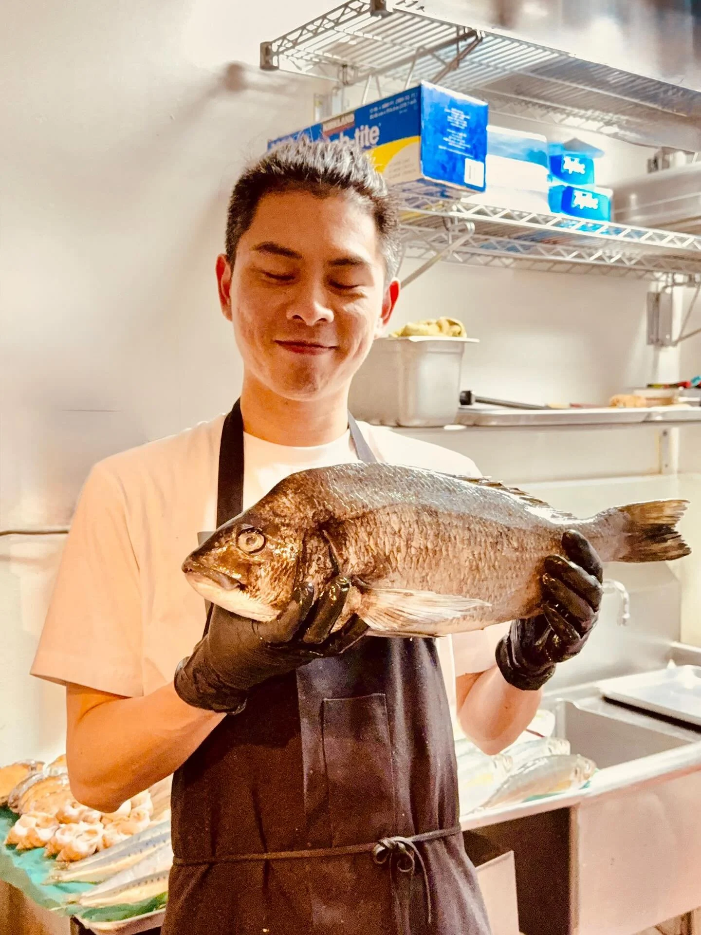 Cradled in Chef Li&rsquo;s hands is a marvel from the southern seas-
Kurodai from Kagoshima, radiant in form, sublime in quality.
Rarely does the ocean offer a Black Seabream so rich, so full of grace.
Its presence in our kitchen is fleeting,
but its