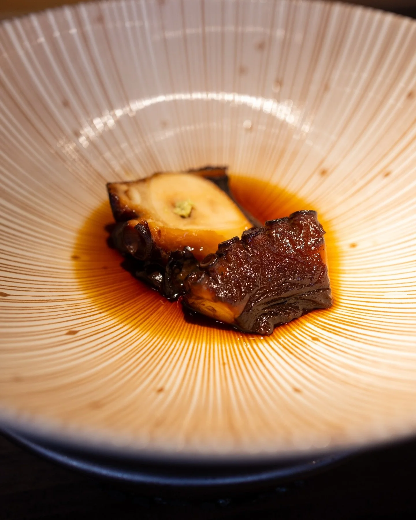 Delicate, slow-braised octopus in a deep soy reduction. One of everyone&rsquo;s favorite bites at Iki Omakase!

📍Iki Omakase, Palo Alto

#omakase #sushiomakase #japanesefood #sushilover