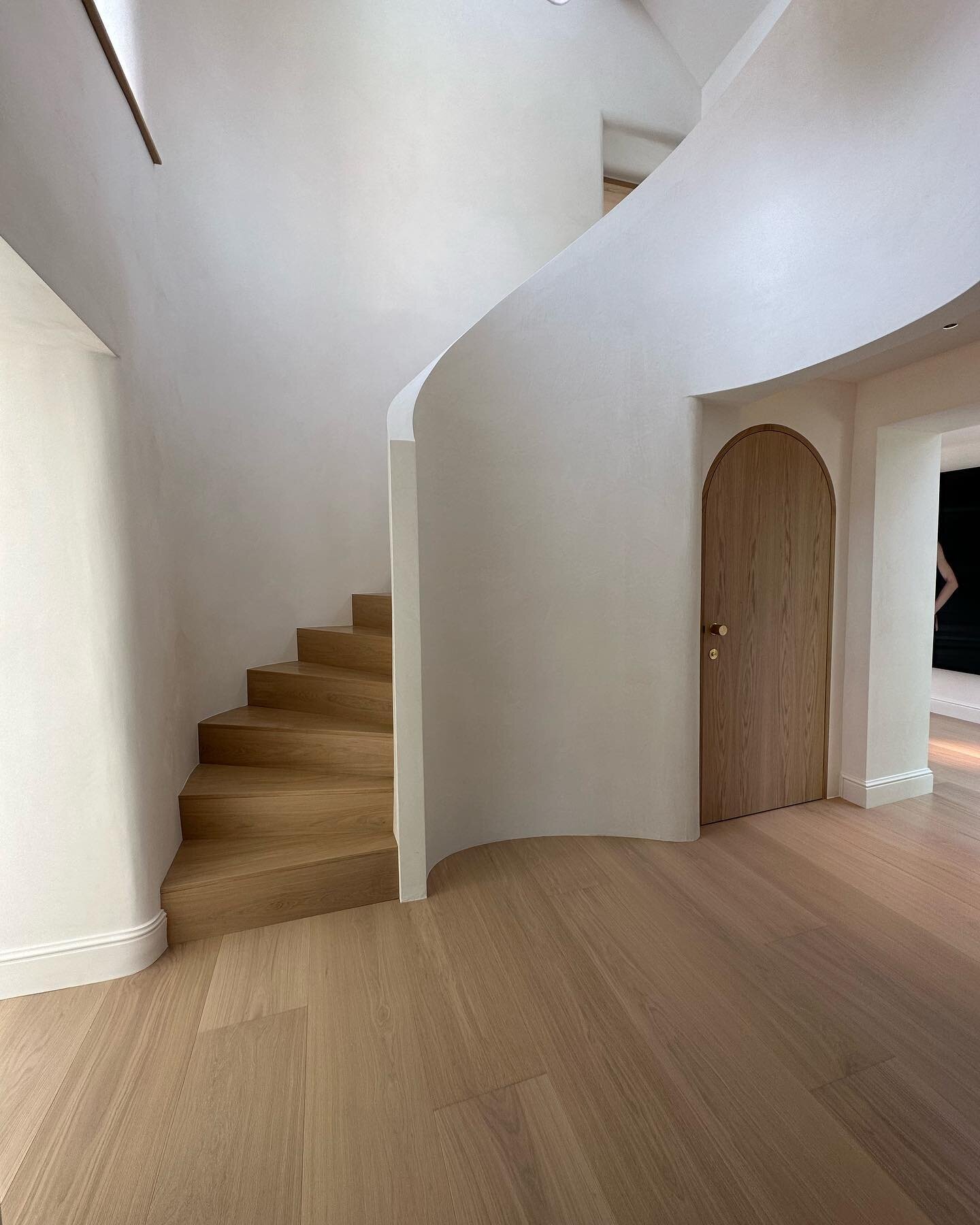 The staircase - our builder @twparker1 made us this incredible curved staircase and hallway, we are so happy with how it came out. The walls around the stairs are painted in @bauwerkcolour colour Bone, the flooring is @trunkfloor. Can&rsquo;t wait to
