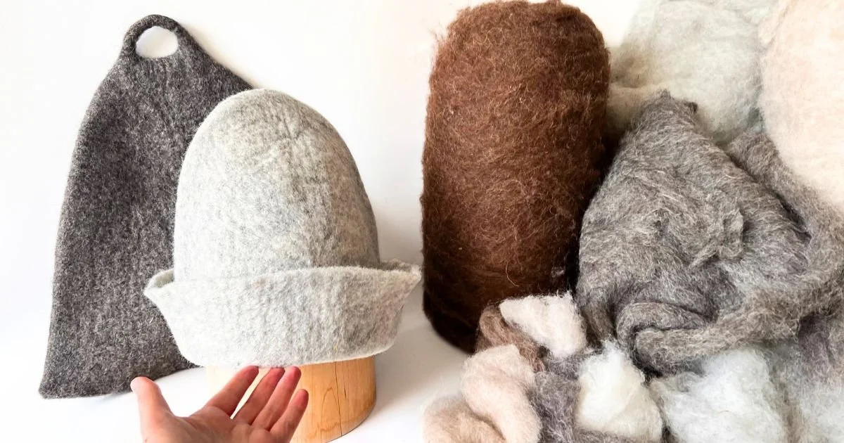 Feltforma undyed wool sauna hats in natural grey and brown shades, hand-felted from raw Alpine sheep wool, made in Europe and made to order, shown with wooden shaping form and unspun wool fiber