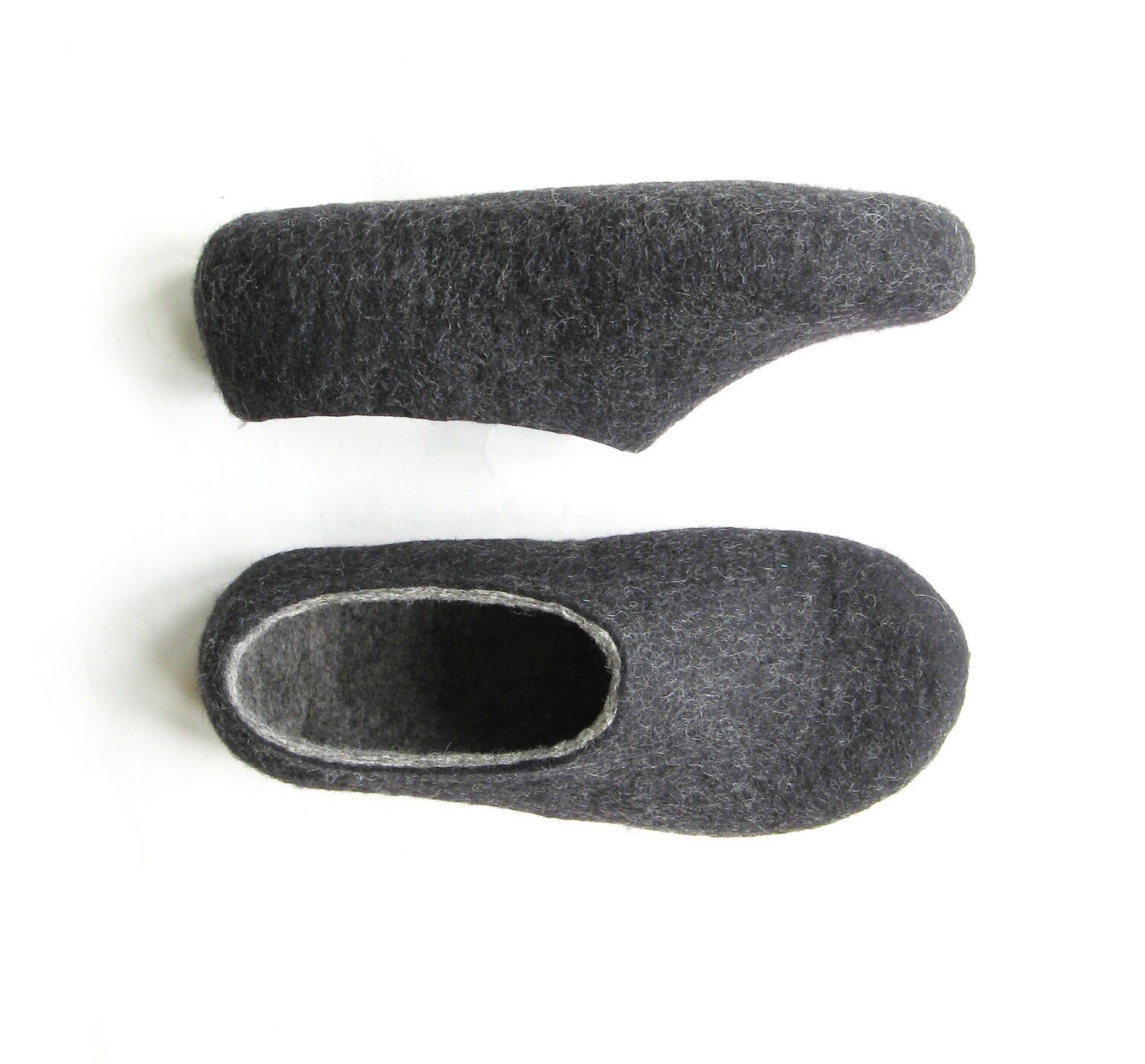 Side view of minimalist felted house shoes in dark gray. Breathable and glue-free, designed for grounding rituals and slow living.