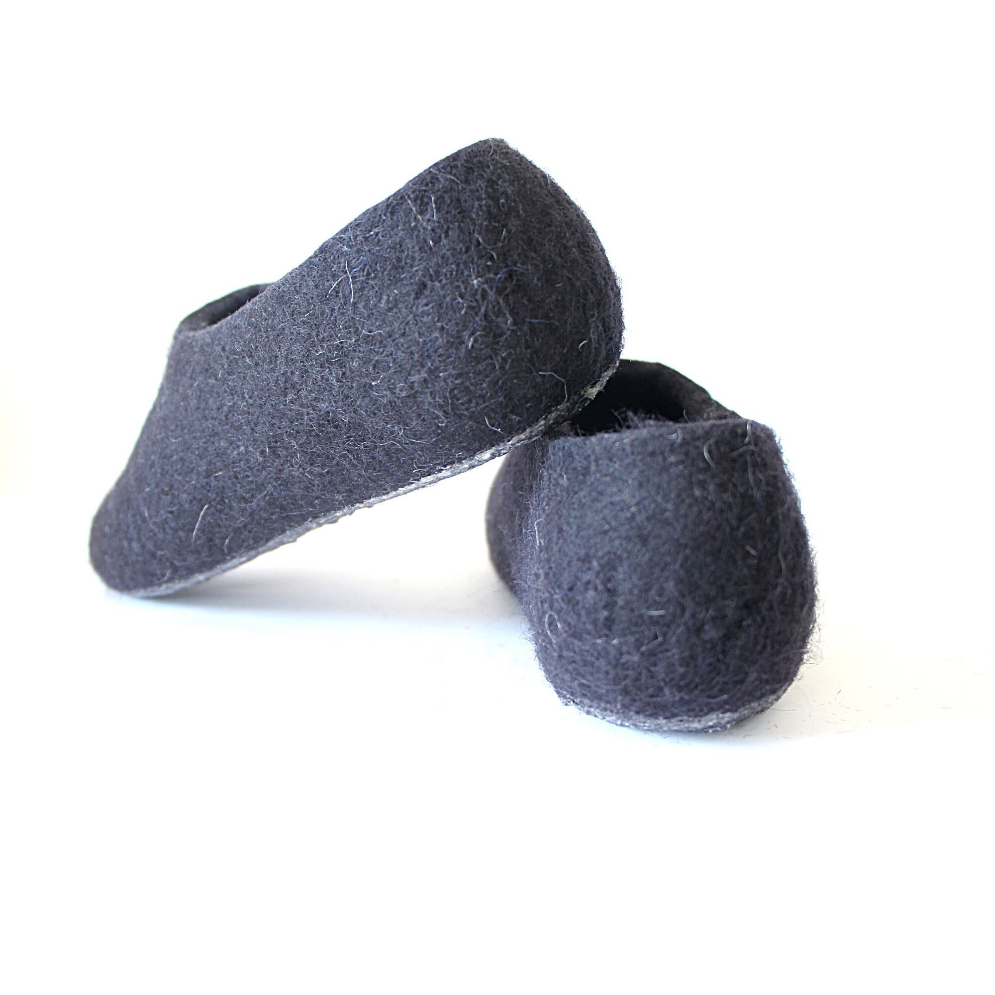 Close-up of wool texture in deep black showing soft, breathable fibers. Ideal for mindful living, slow fashion, and year-round comfort.