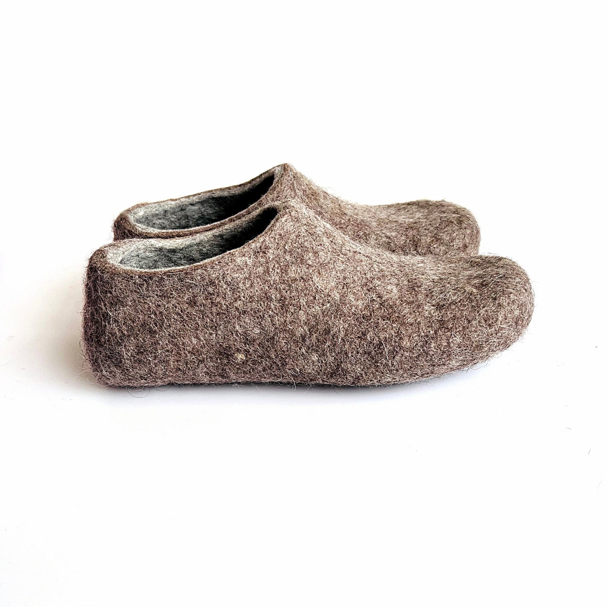 Felted wool slippers in gray and beige for women. Handmade from organic wool for cozy barefoot comfort and grounding.