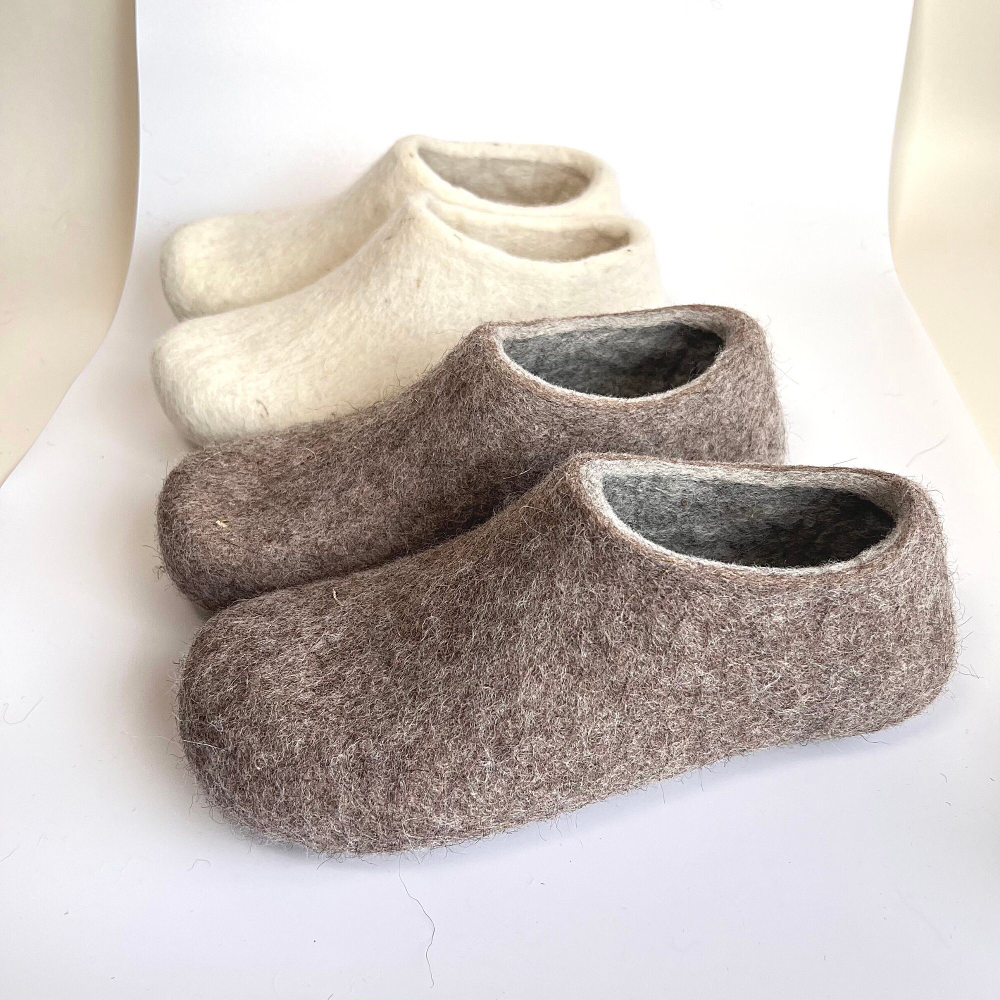Side profile of handmade wool slippers in soft neutral tones. Designed for indoor grounding, gifting, and slow days.