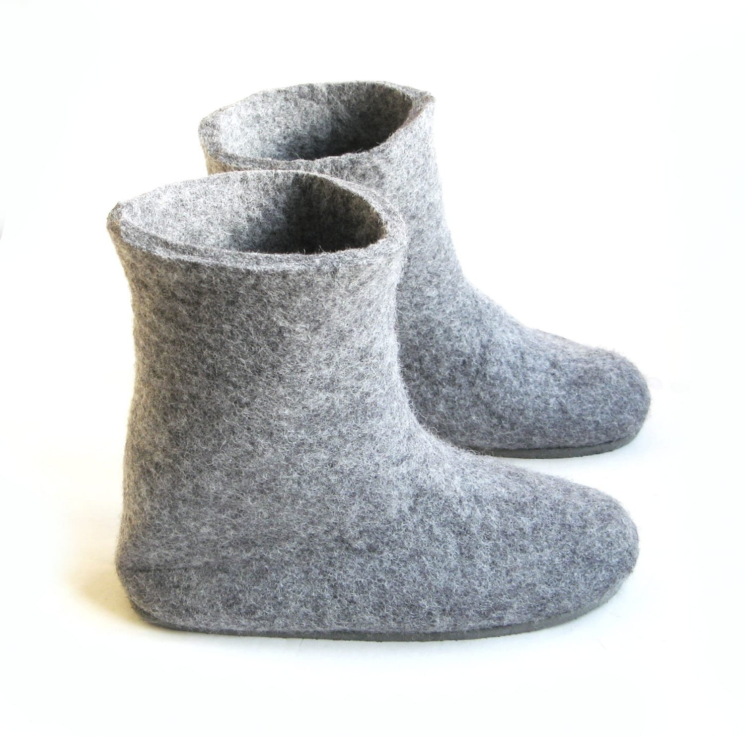 Tall felt slippers in dark gray with natural texture and seamless shape. Handmade and eco-friendly for barefoot-style living.