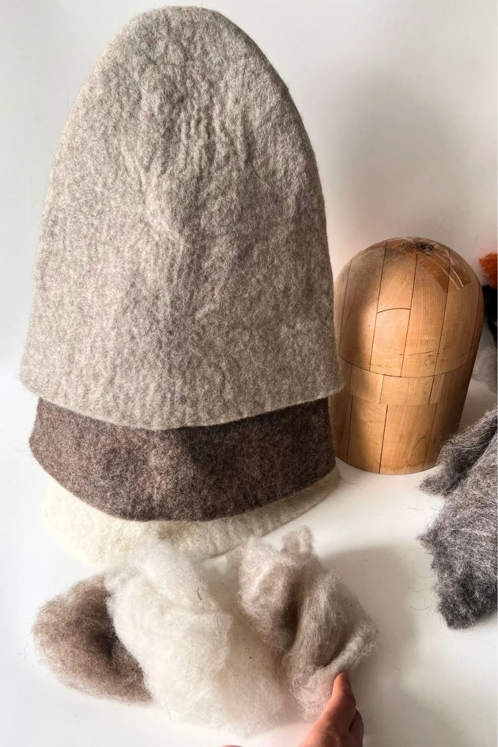 Handmade, undyed wool sauna hats — natural shades, adjustable one-size fit, made to order.