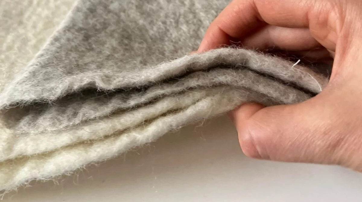 Dense layers of undyed Tyrolean mountain wool sauna hat — thick seamless construction with no glue, no stitching, no synthetic materials. Built for infrared sauna and contrast therapy. Handmade in Vilnius, Lithuania.