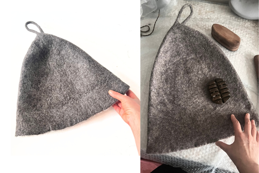 Gray undyed wool sauna hat with a loop, finished and on the felting table with wooden felting tools