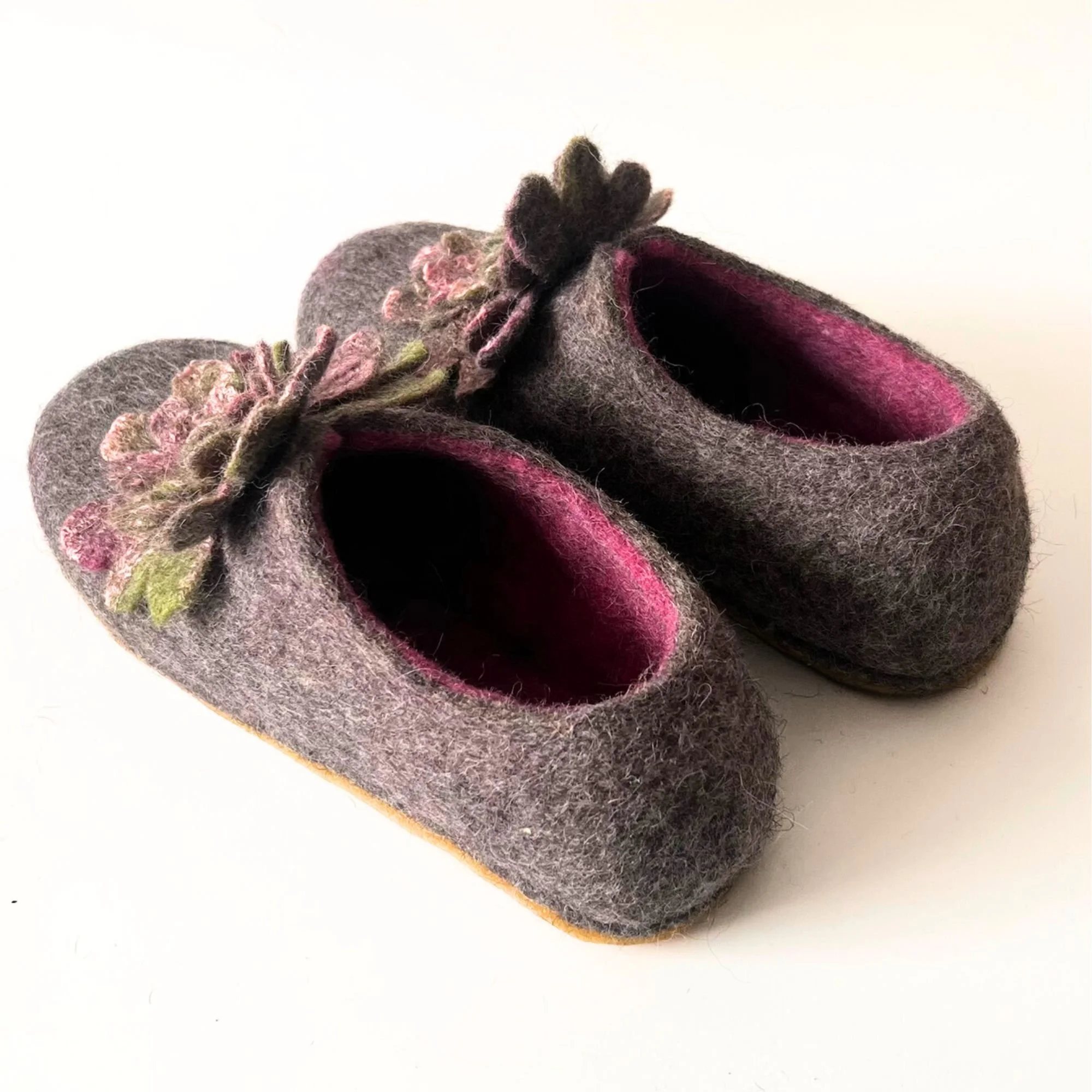 Warm wool house shoes for women designed for hardwood floors with flexible natural rubber sole and insulated wool upper