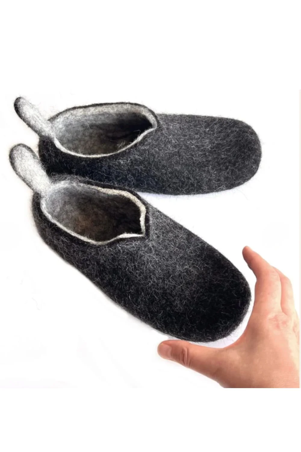 Handmade wide fit wool slippers for plantar fasciitis in natural charcoal — zero-drop sole, wide toe box, no glue, no synthetic materials. Hand-sculpted from undyed Tyrolean mountain wool in Vilnius, Lithuania. Ships duty-free to the USA.
