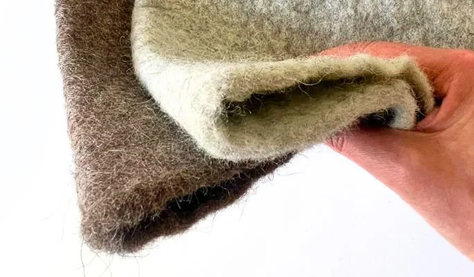 Inside of an undyed wool sauna hat, showing wool only with no lining or glue