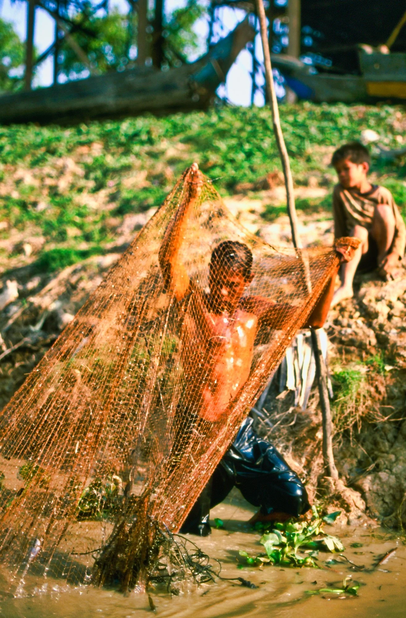 Tonle Sap Fisherman and boy, Cambodia