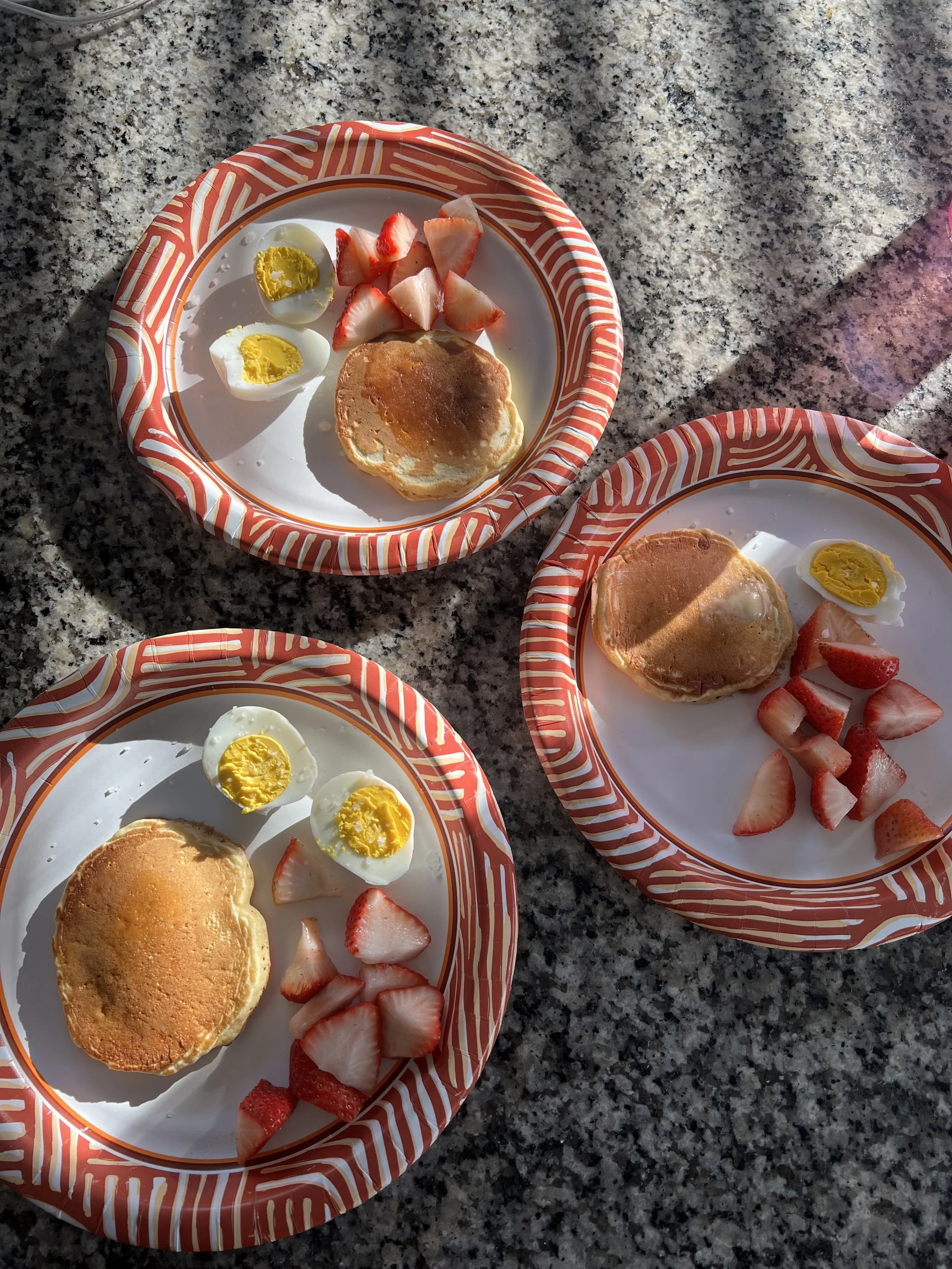 Pancakes, boiled eggs, strawberries