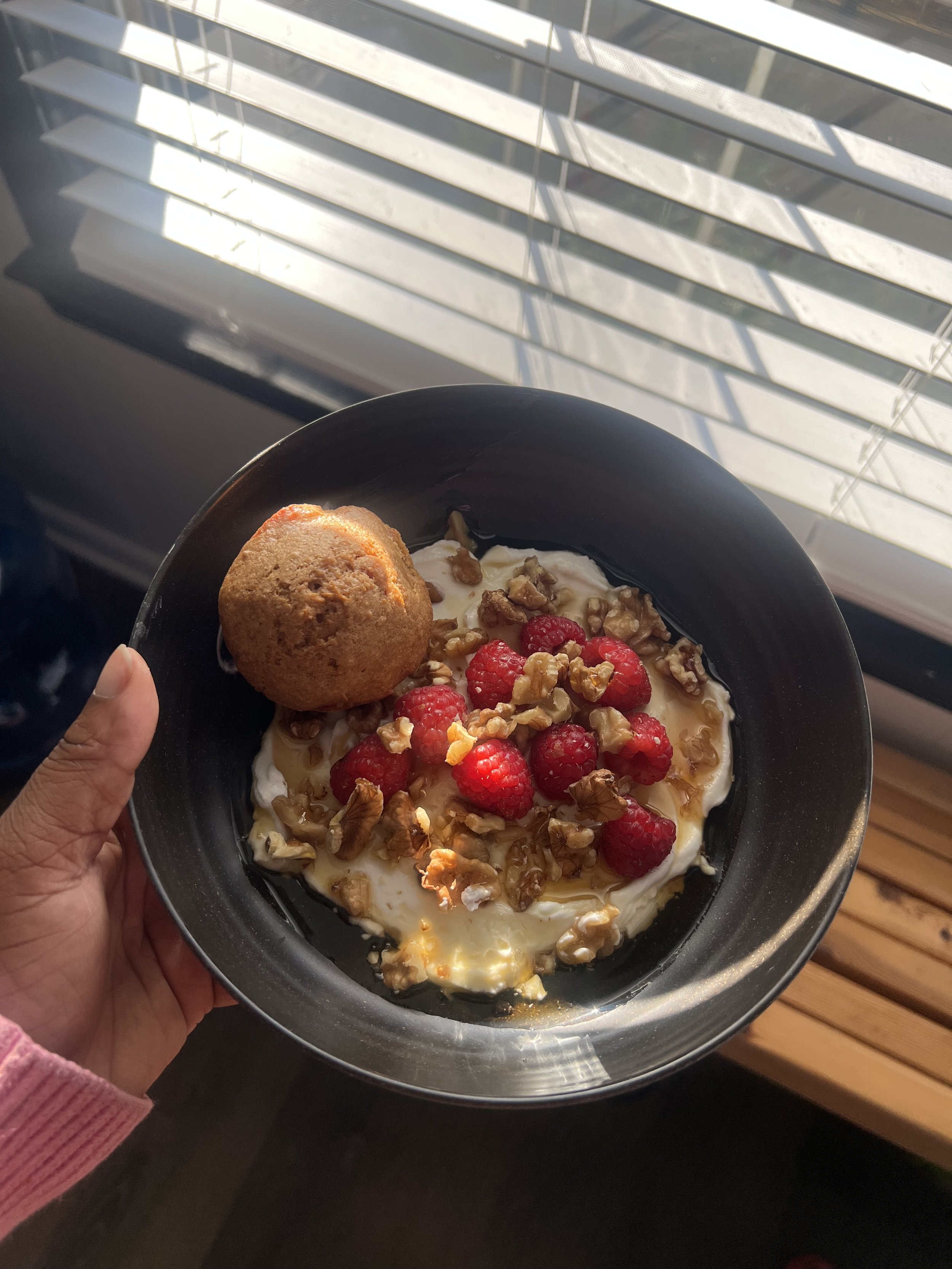 Plain whole milk yogurt parfair with walnuts, raspberries, and honey and a Spelt muffin