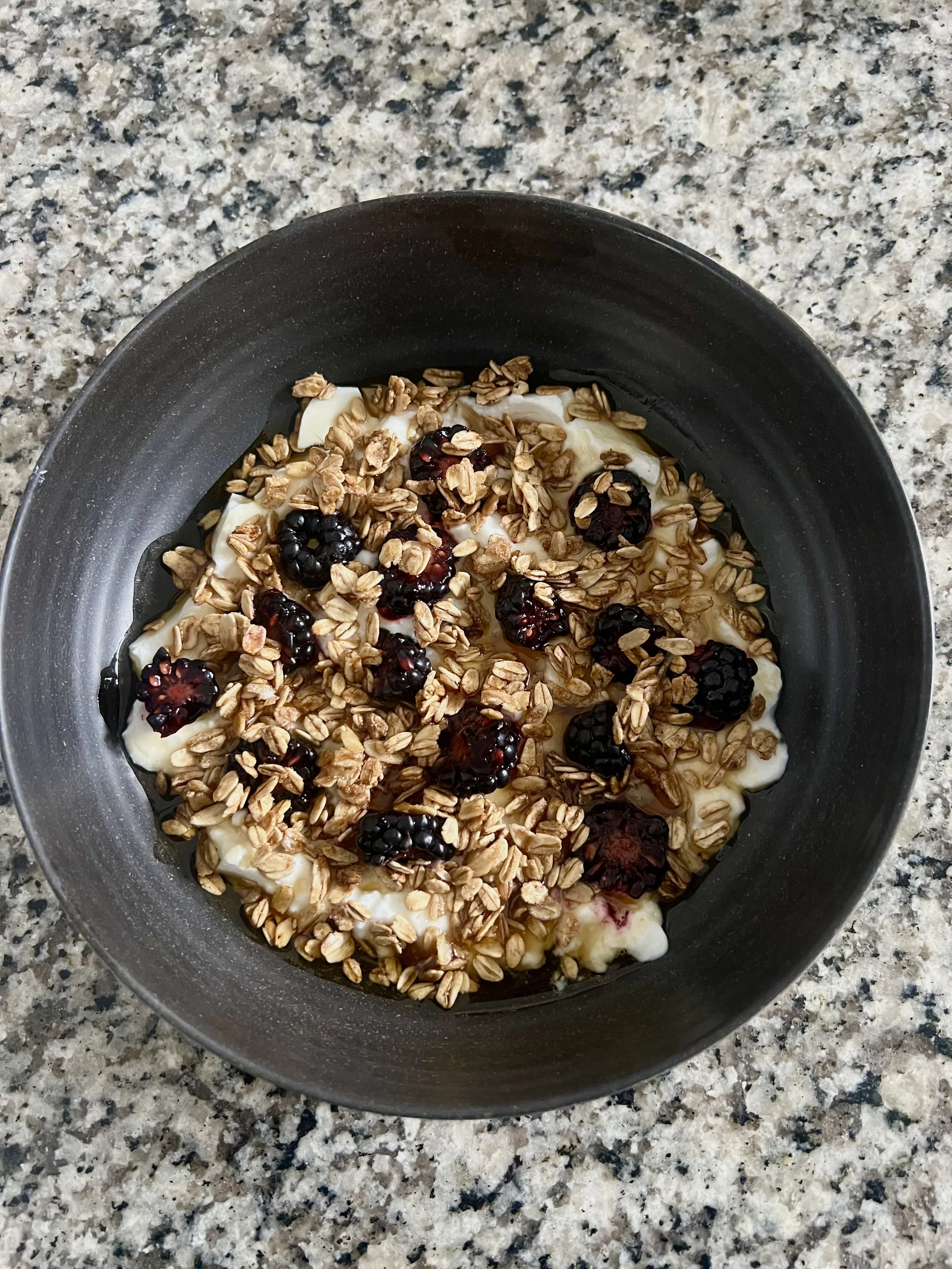 Plain whole milk yogurt parfait with granola, blackberries, and pure maple syrup