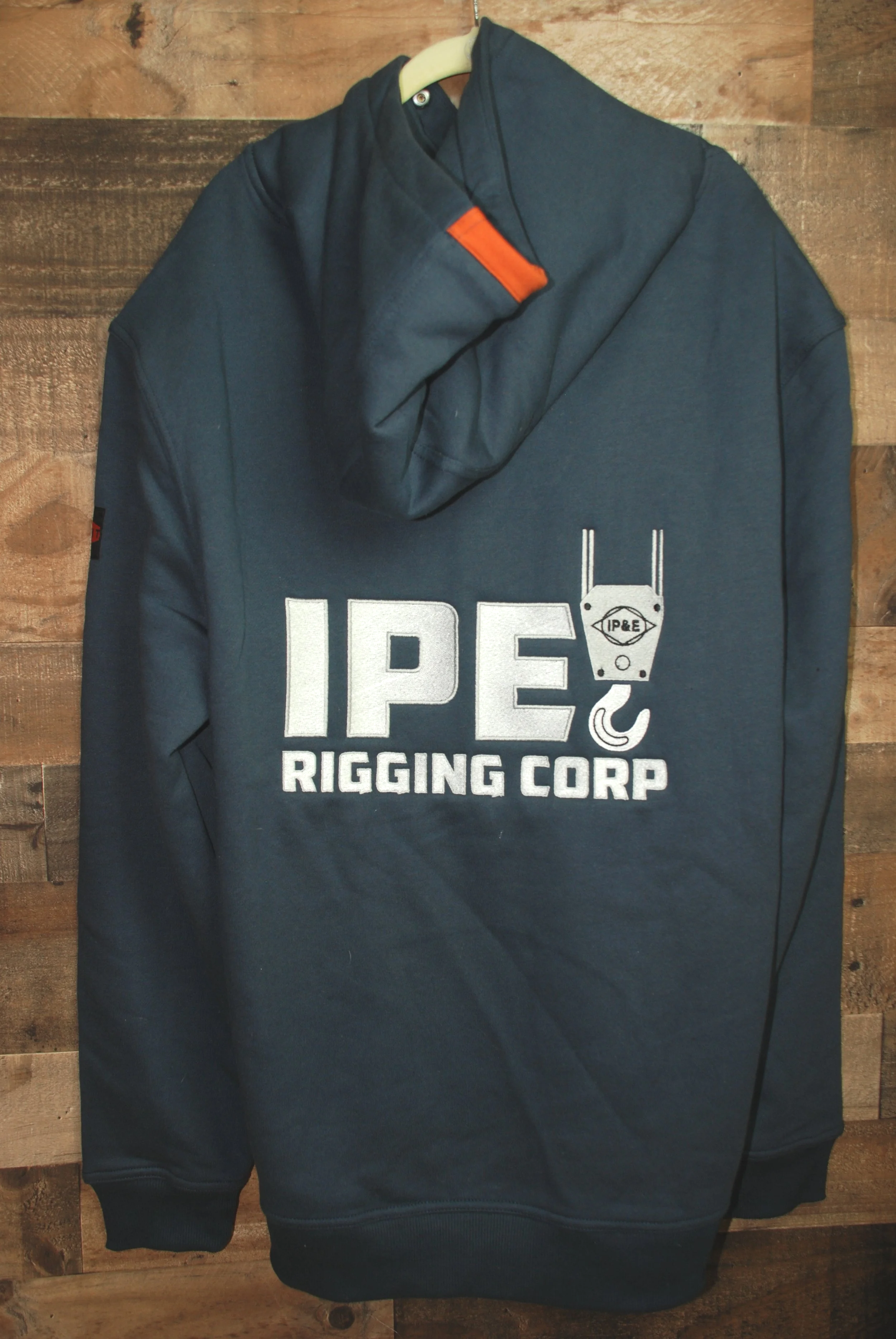 Navy blue sweatshirt with IP&E Rigging Corp logo embroidered on back