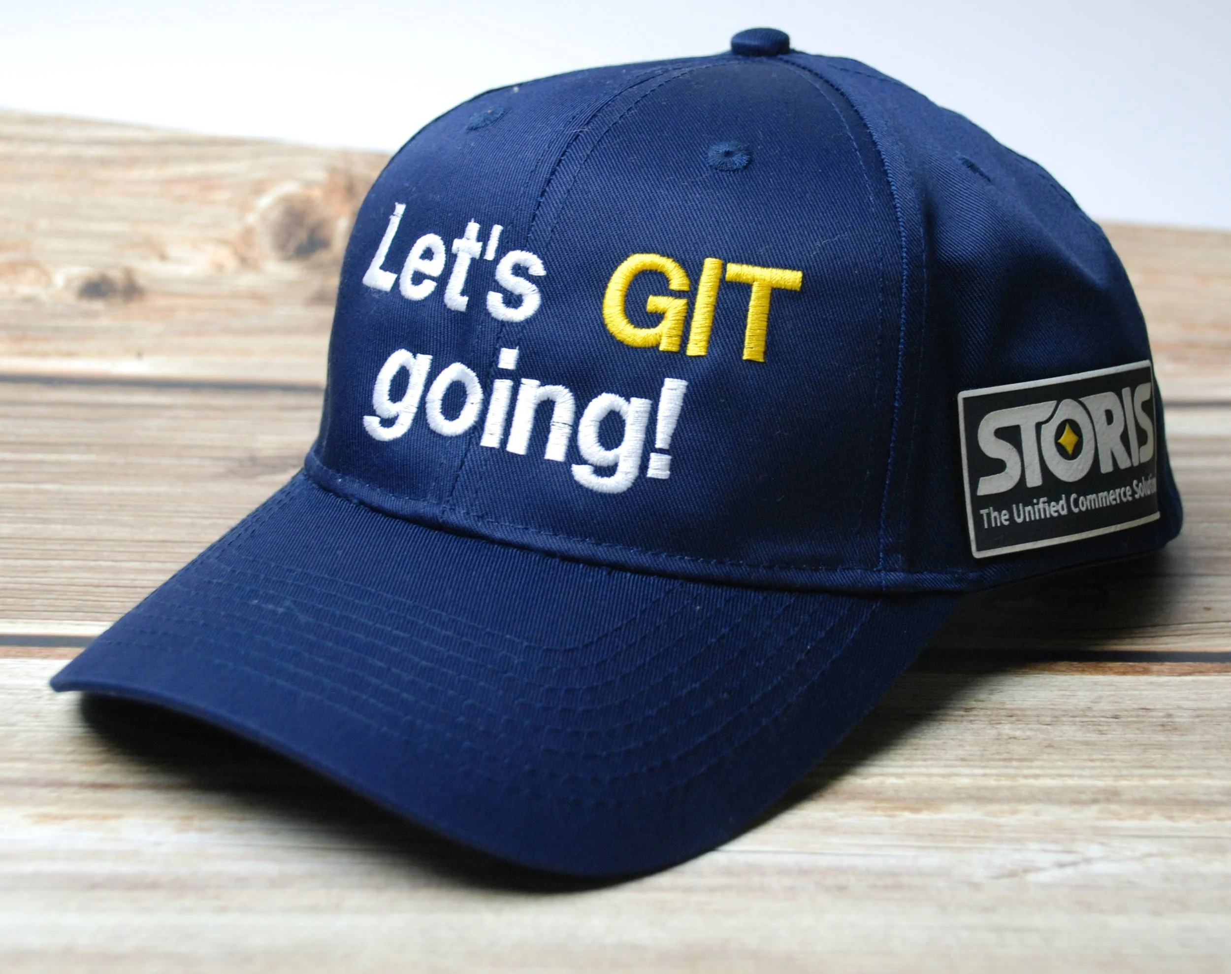 embroidered slogan baseball hat with leatherette patch on side in company logo