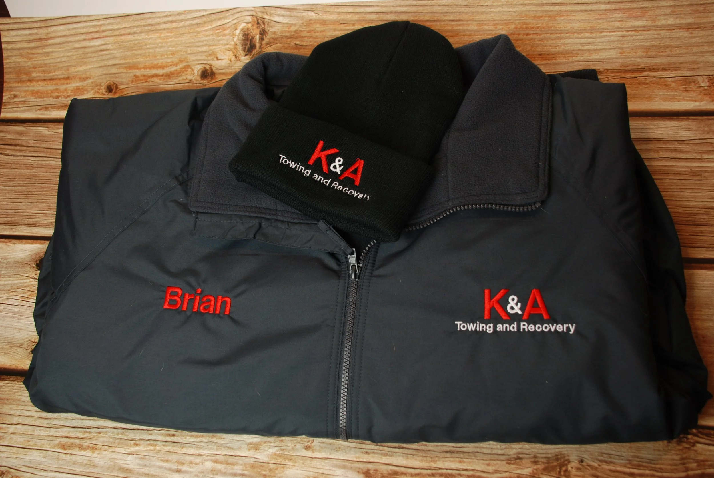 Embroidered company jacket and matching embroidered knit hat