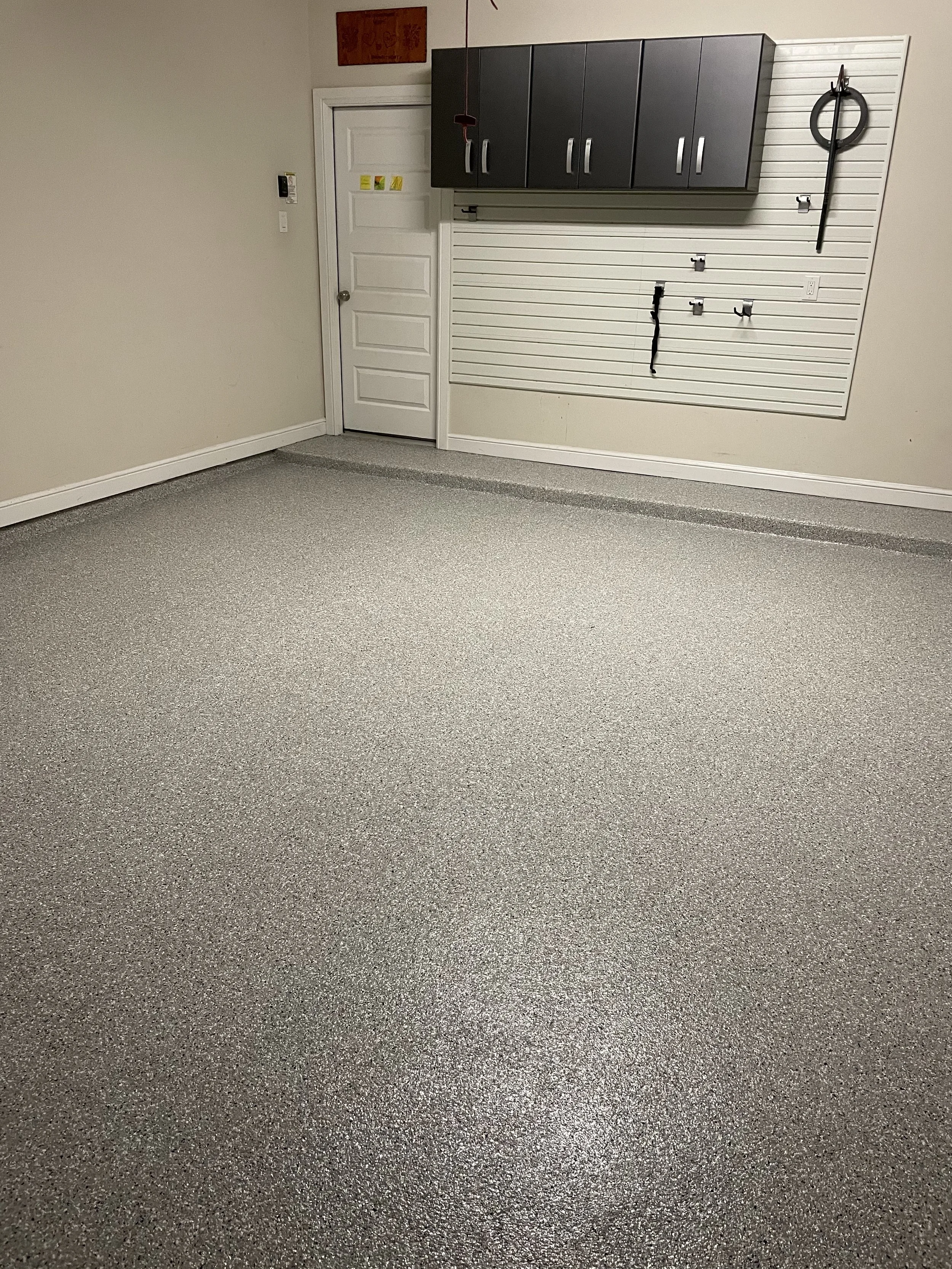 elevate the look and feel of your garage with a garage floor coating. not only does it create an elevated look but it makes cleaning a breeze and protects your concrete floor. 
