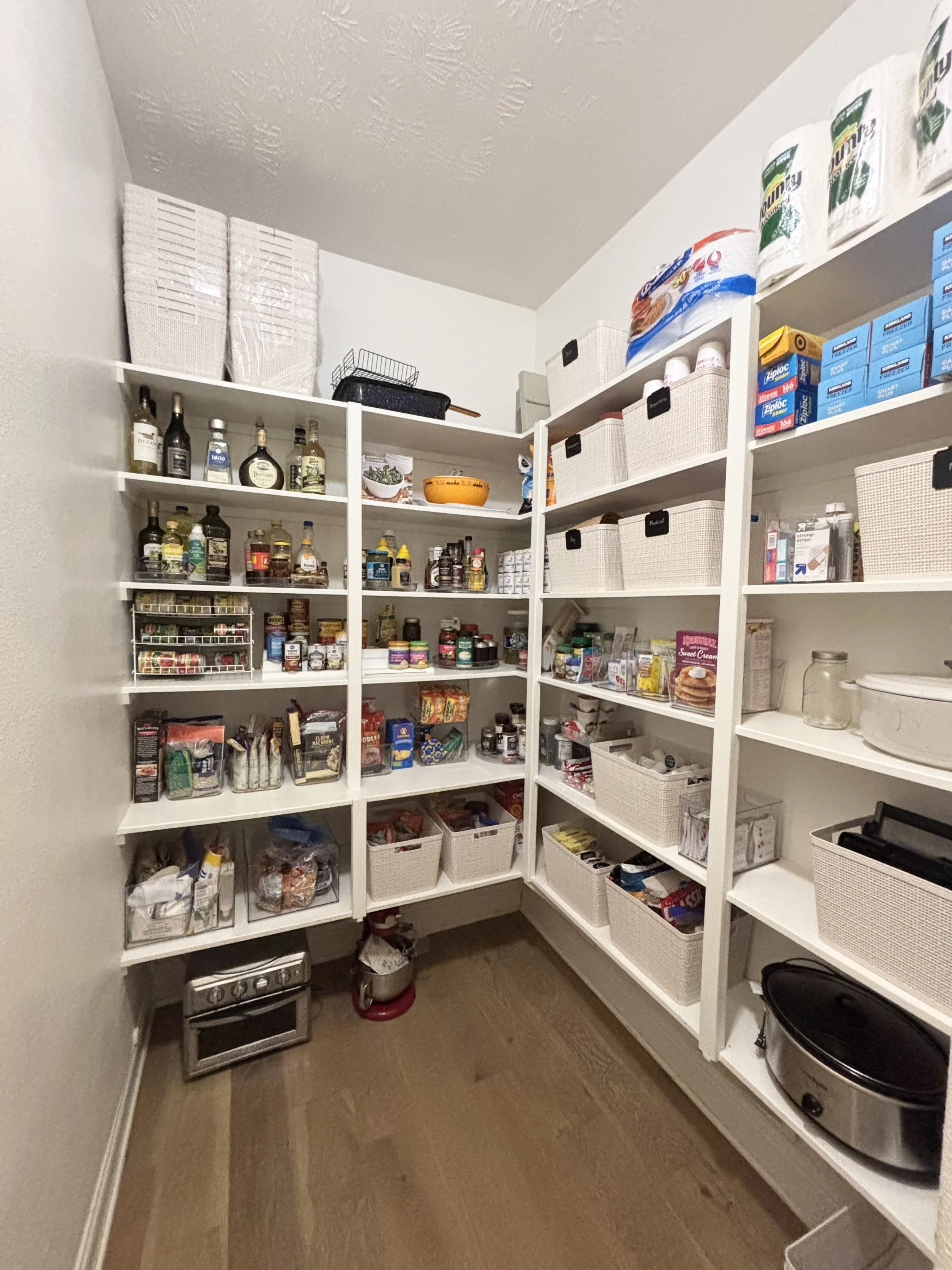 An organized pantry isn't about having the perfect containers—it's about creating a system that works for you and your family. This pantry was thoughtfully decluttered and reorganized to make everyday items easier to find, access, and put away. By cr