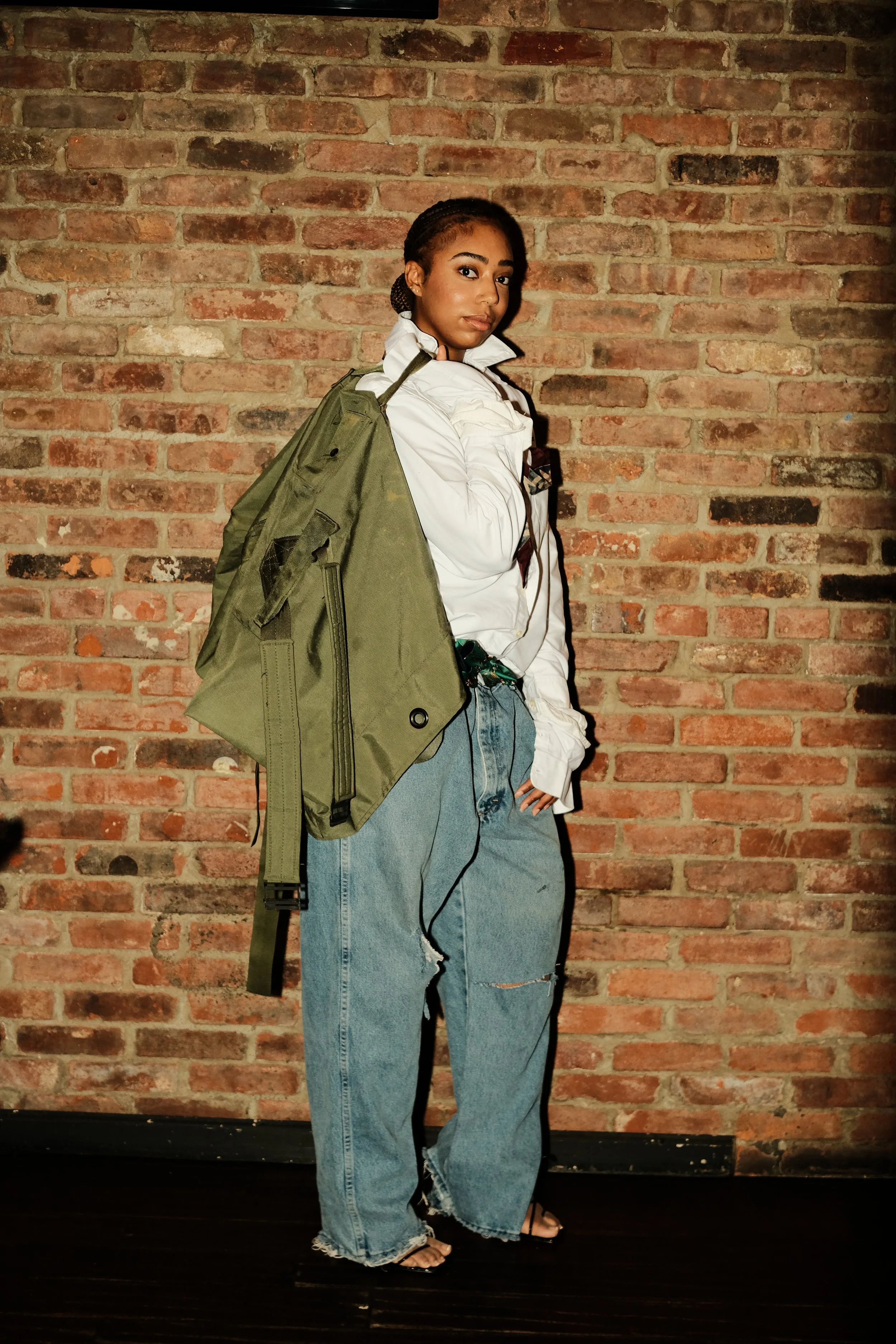 Ameen Workshop Presents: STUDIo_AMEEN
MUSE#02 in 'Kain' Overlapping Oxford, 'Casey' Cargo Duffle Bag, and 'Ian' Denim Jeans.  