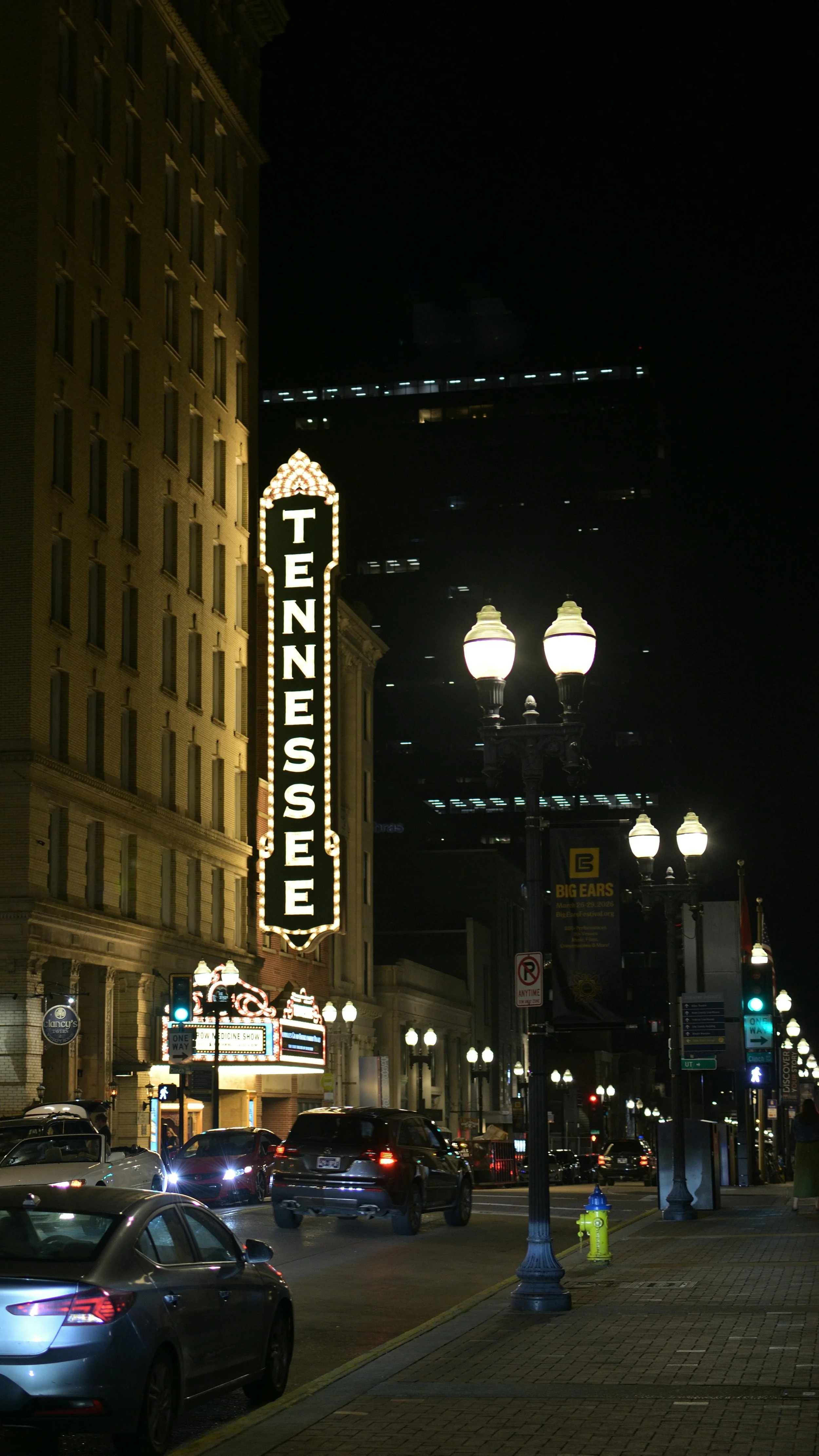 Nighttime glowing Tennessee sign in downtown Nashville