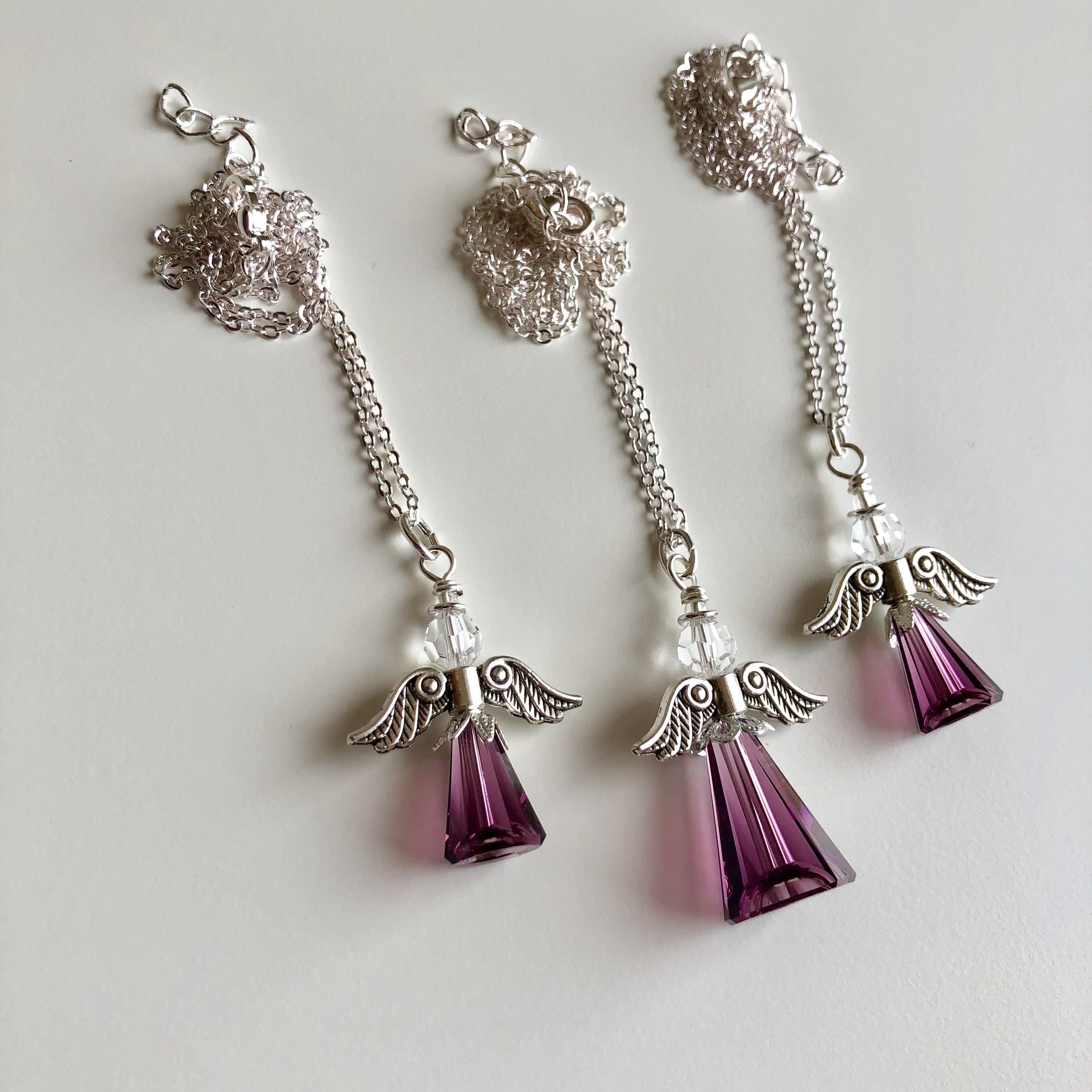 Matching angel necklaces for a mom and her two daughters