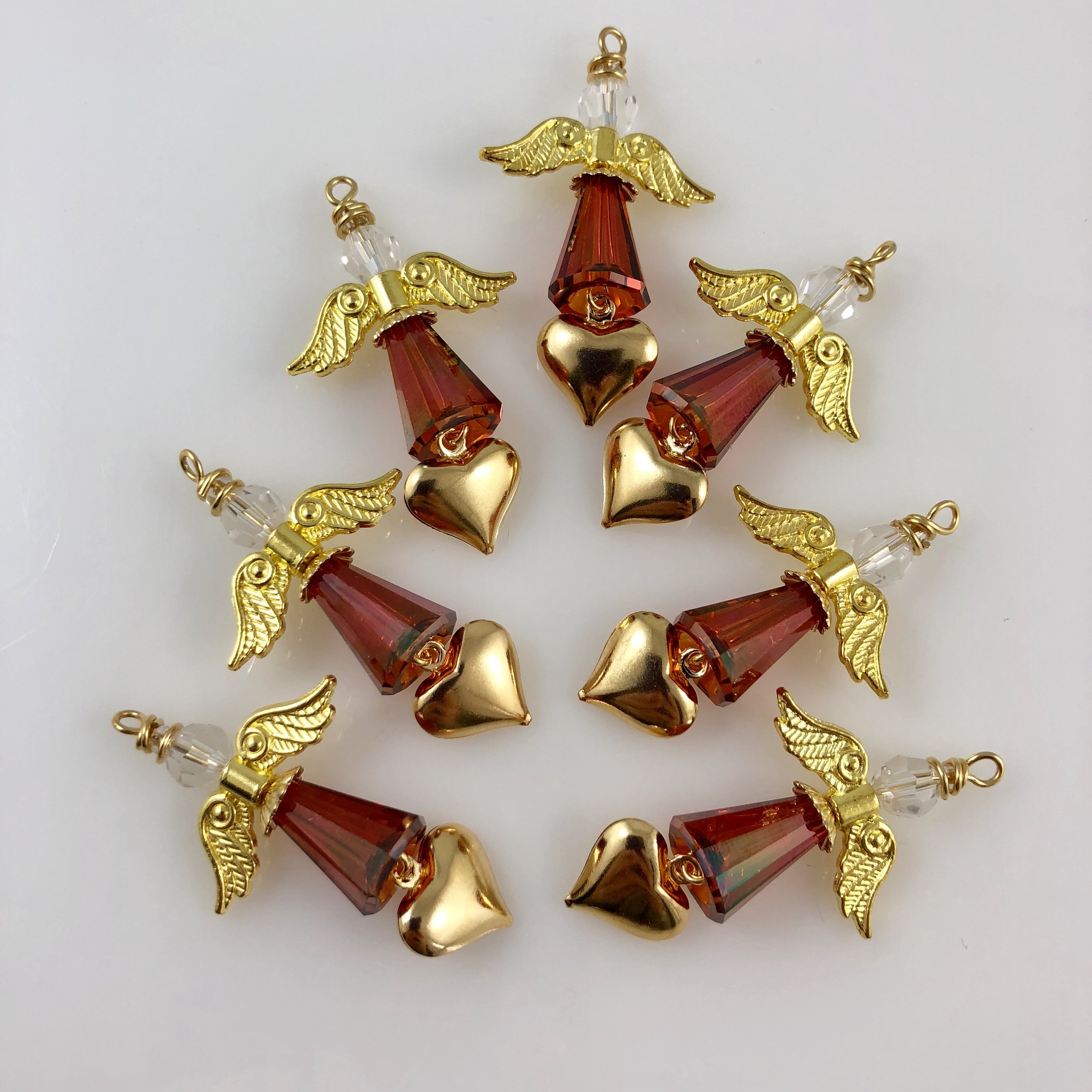 Set of red angels with golden heart charms