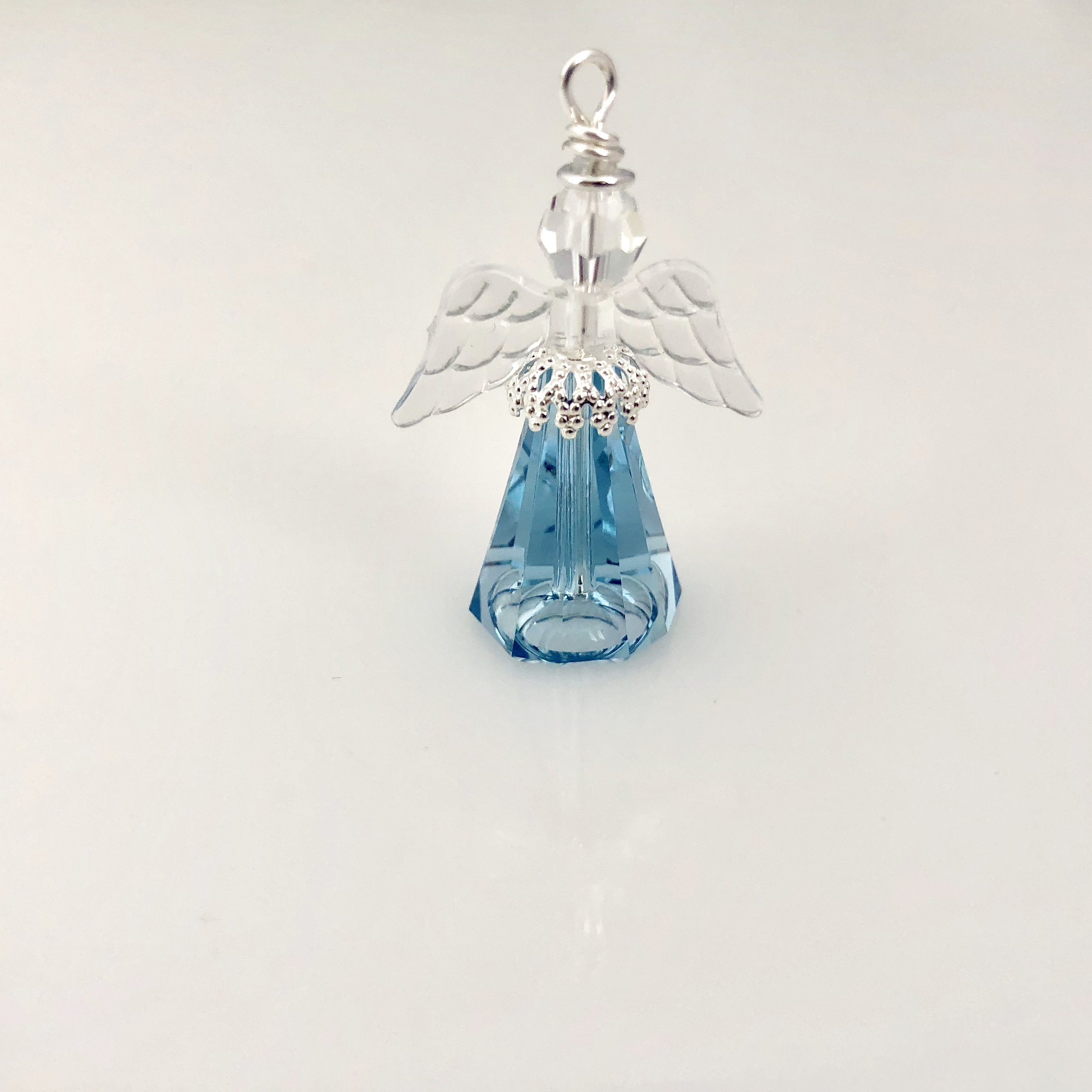 Small light blue angel with clear wings