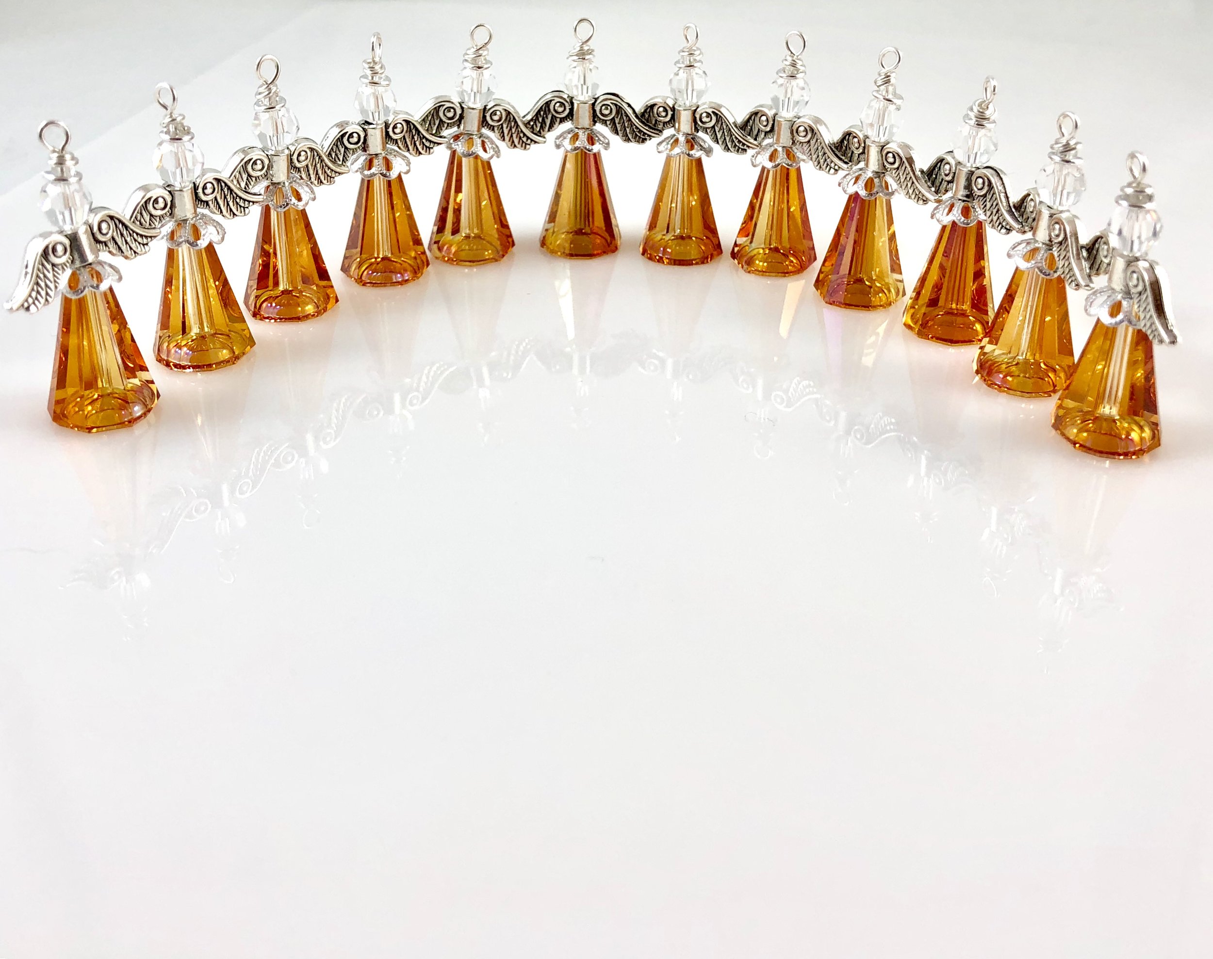 Matching set of large sunset angels with silver wings