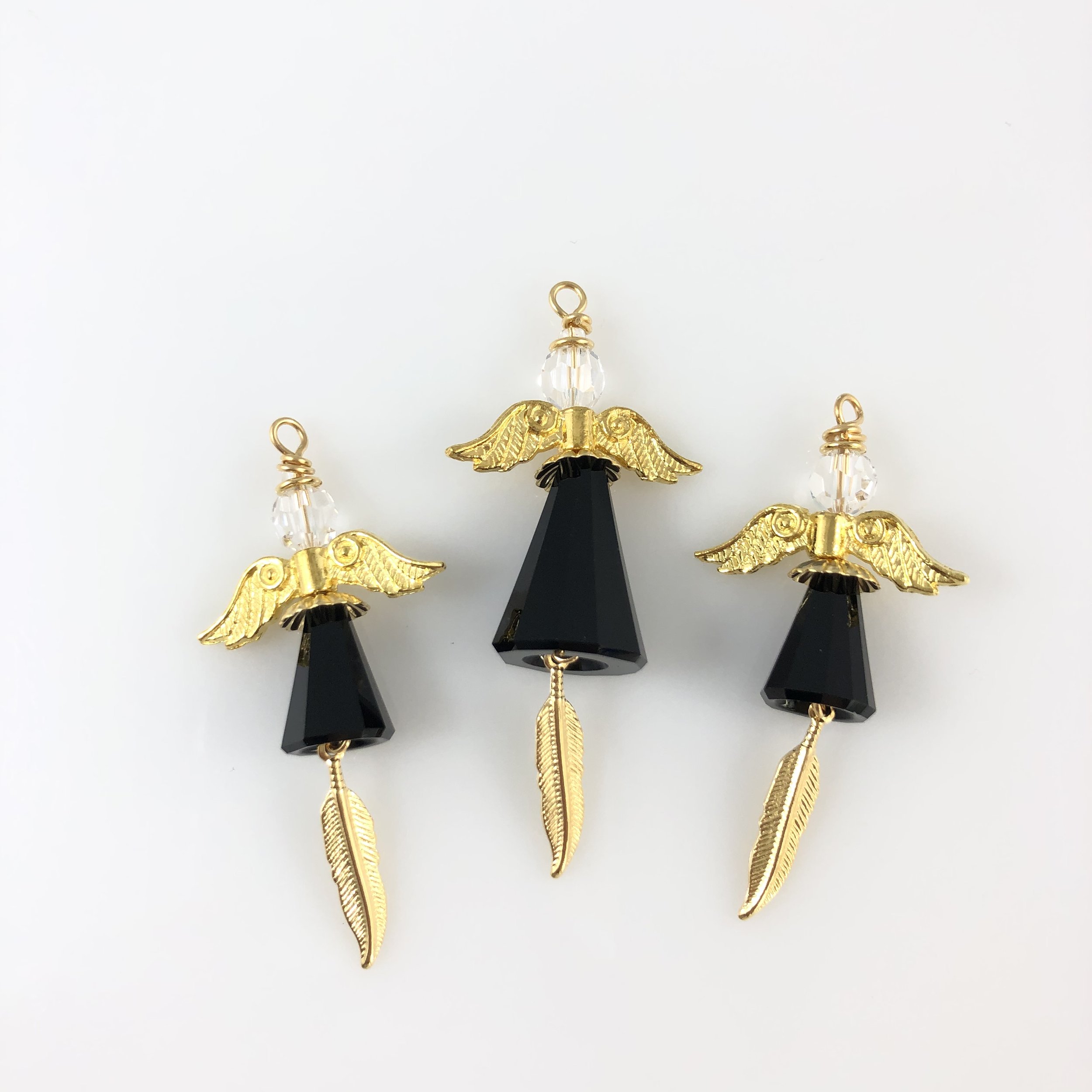 Black angels with gold wings and feather charms