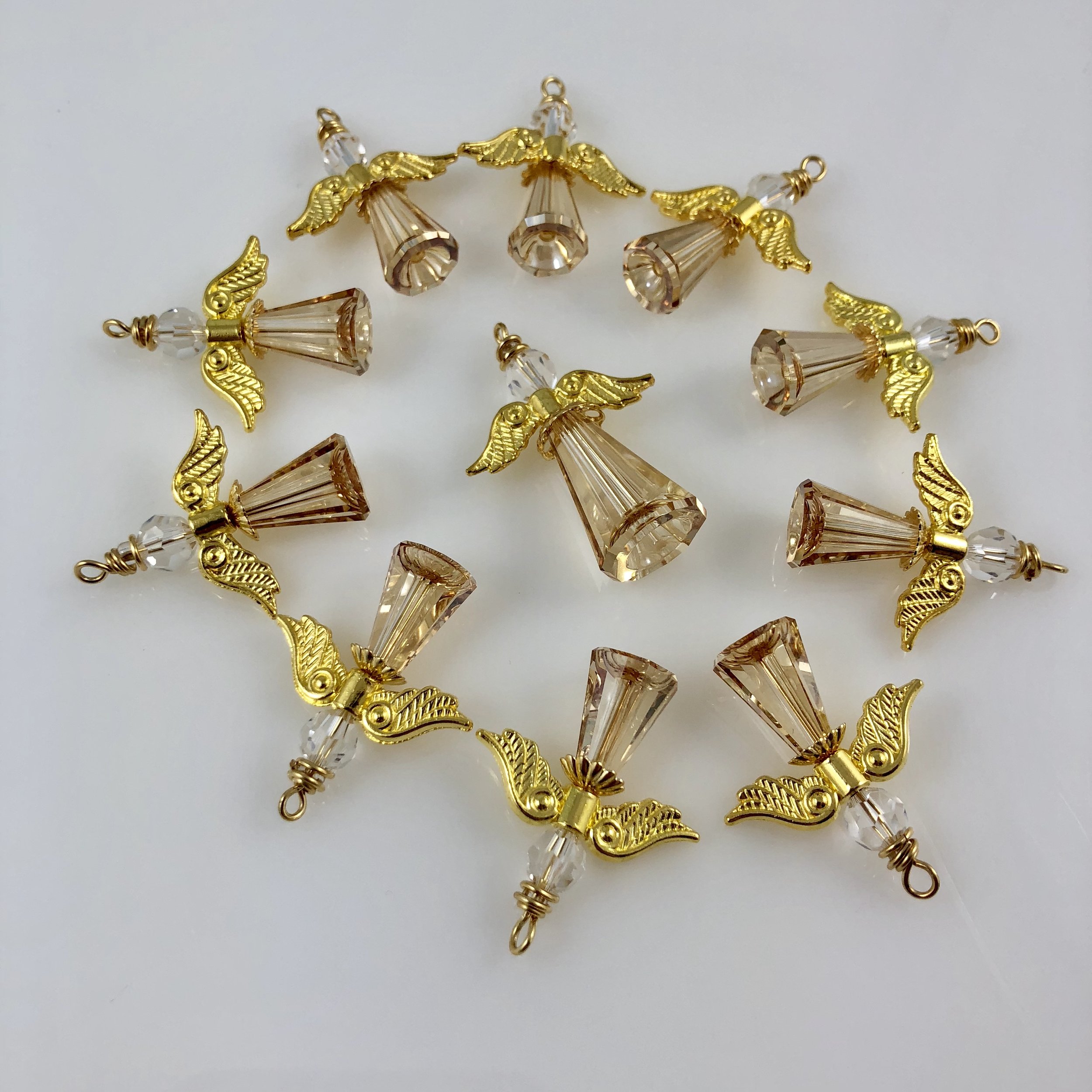 Collection of champagne angels with gold wings